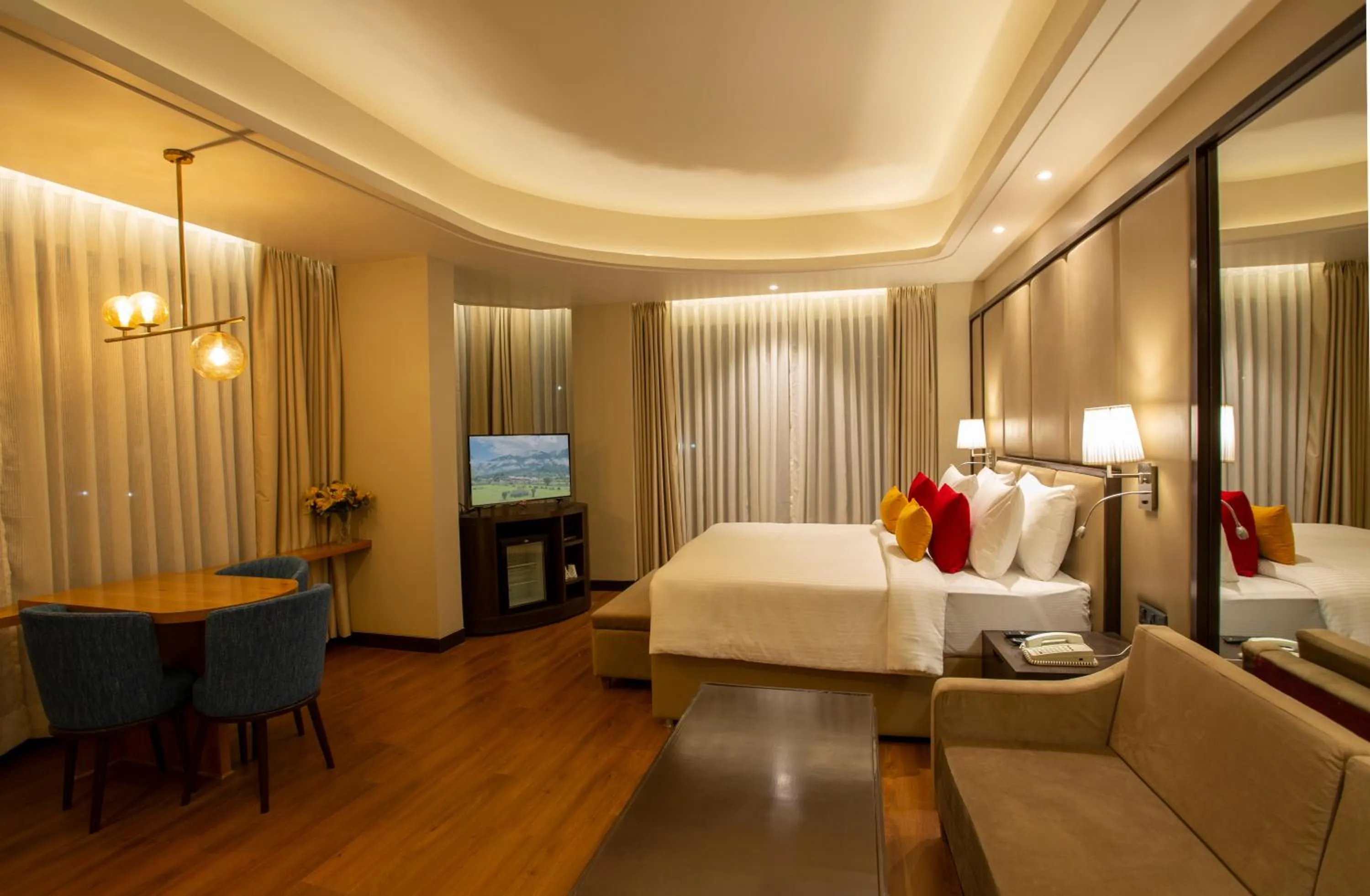 Photo of the whole room, Bed in The Vaishnodevi Sarovar Portico