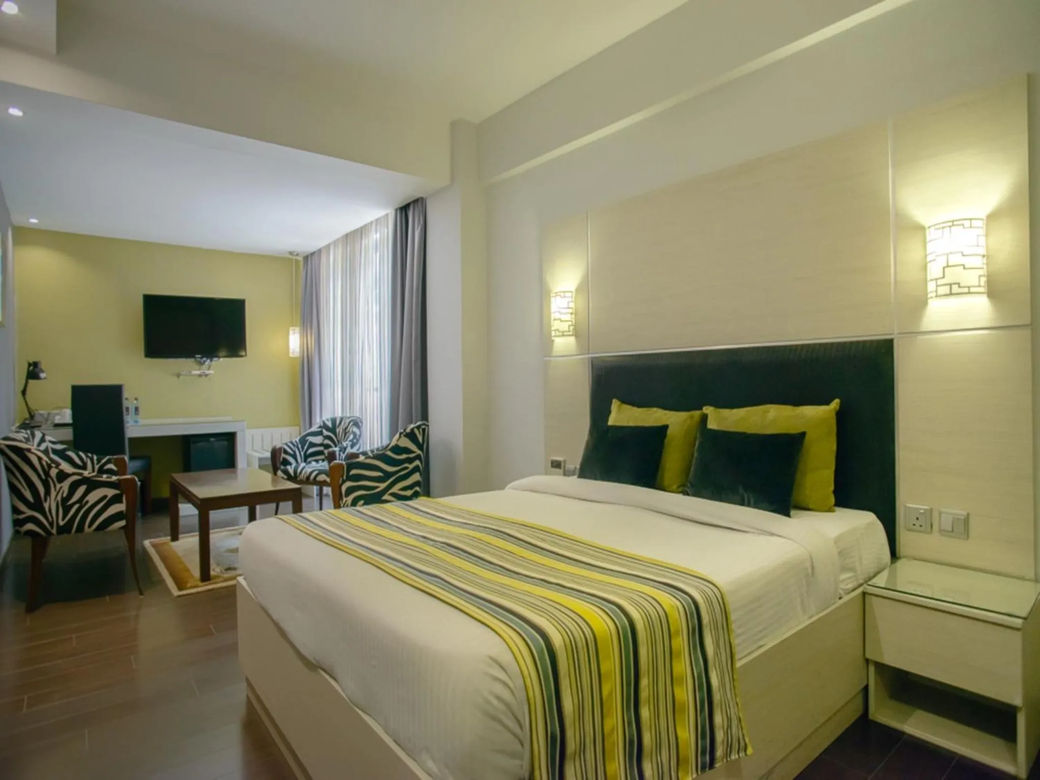 Bed in Cloud Hotel & Suites