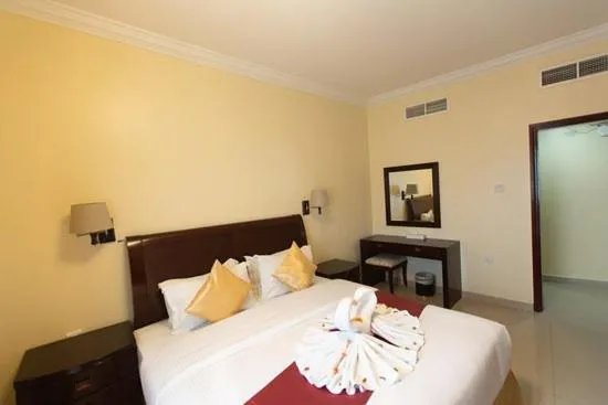 Bed in Crown Palace Hotel