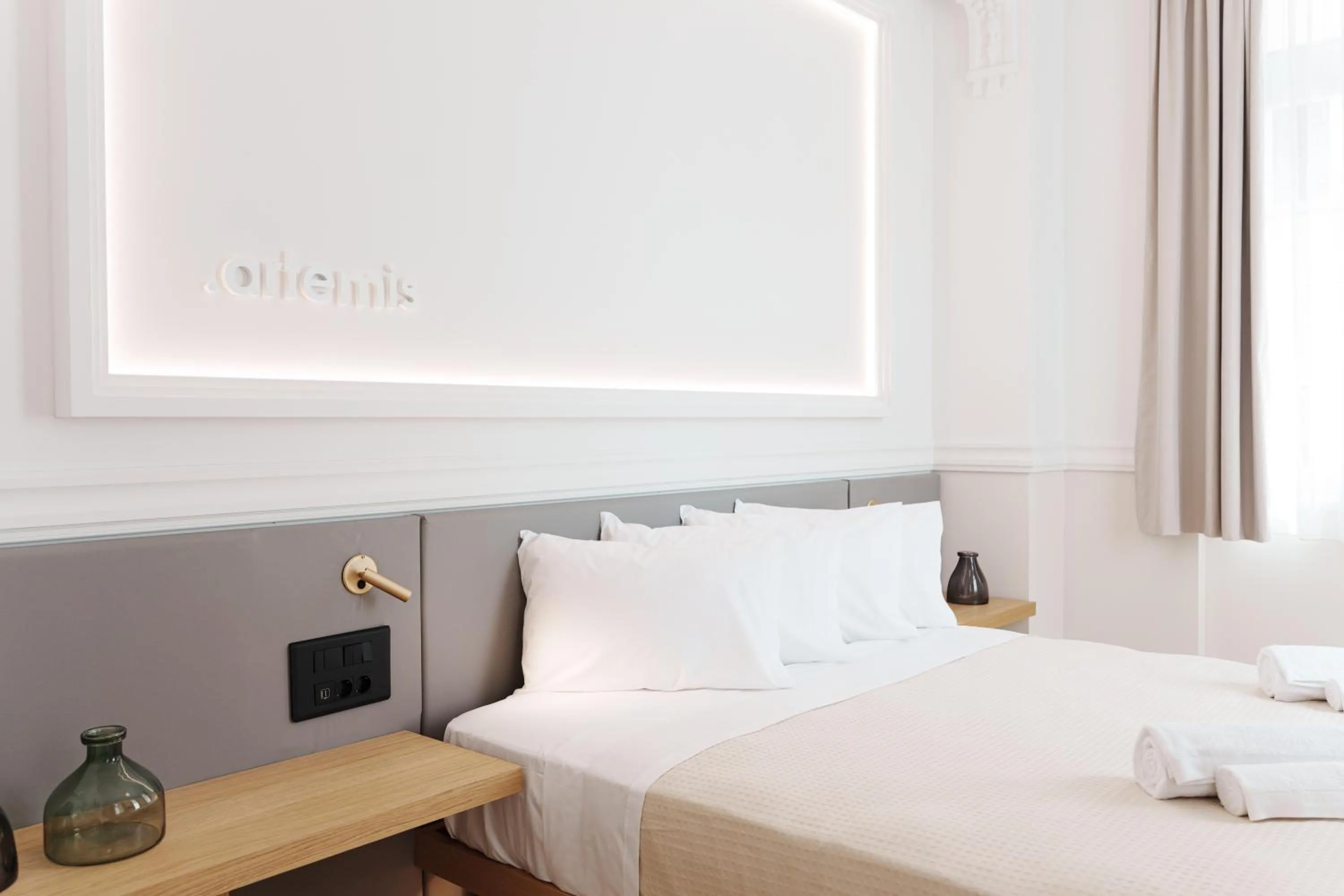 Bed in Agora Athens Suites