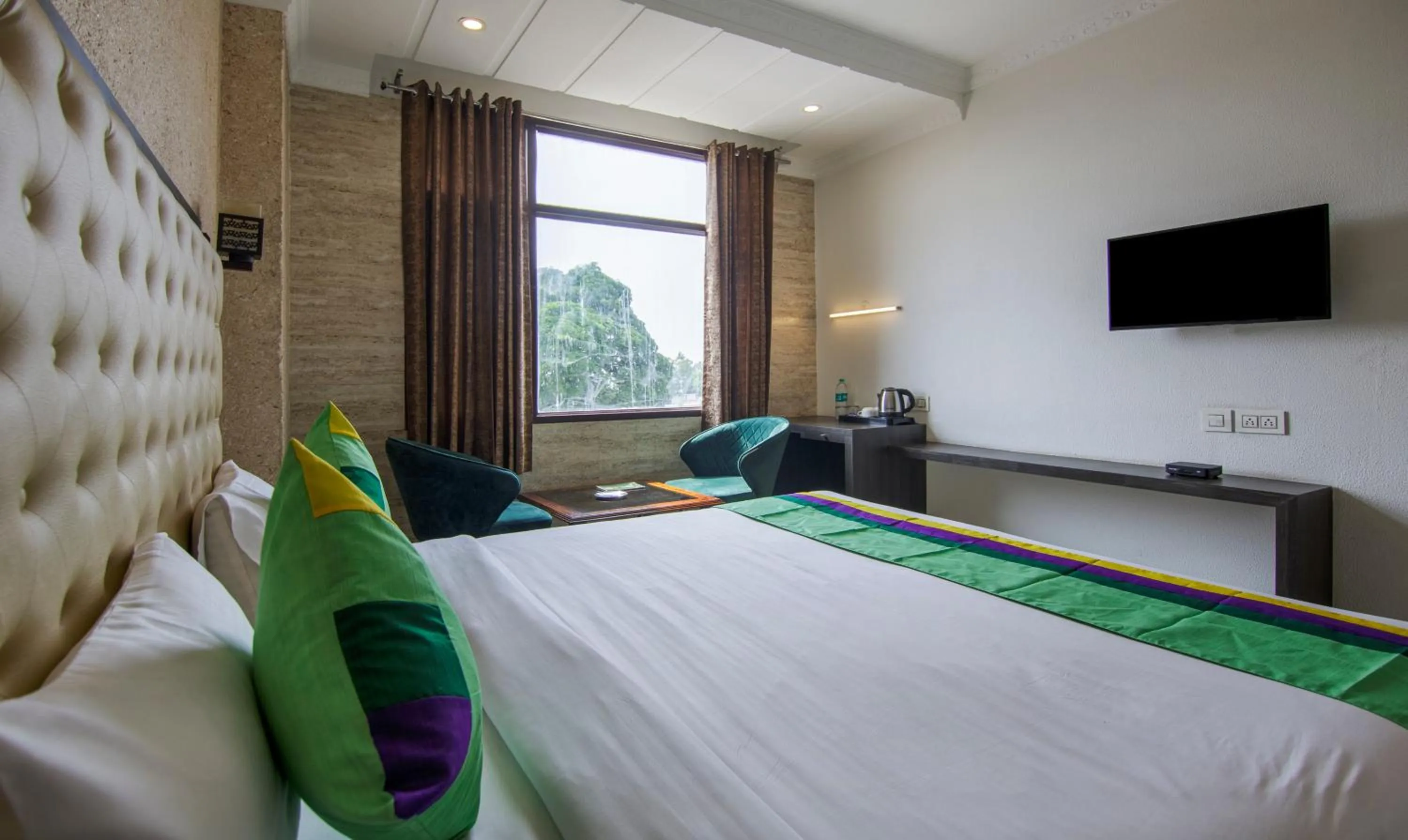 Bed in Treebo Trinetar International