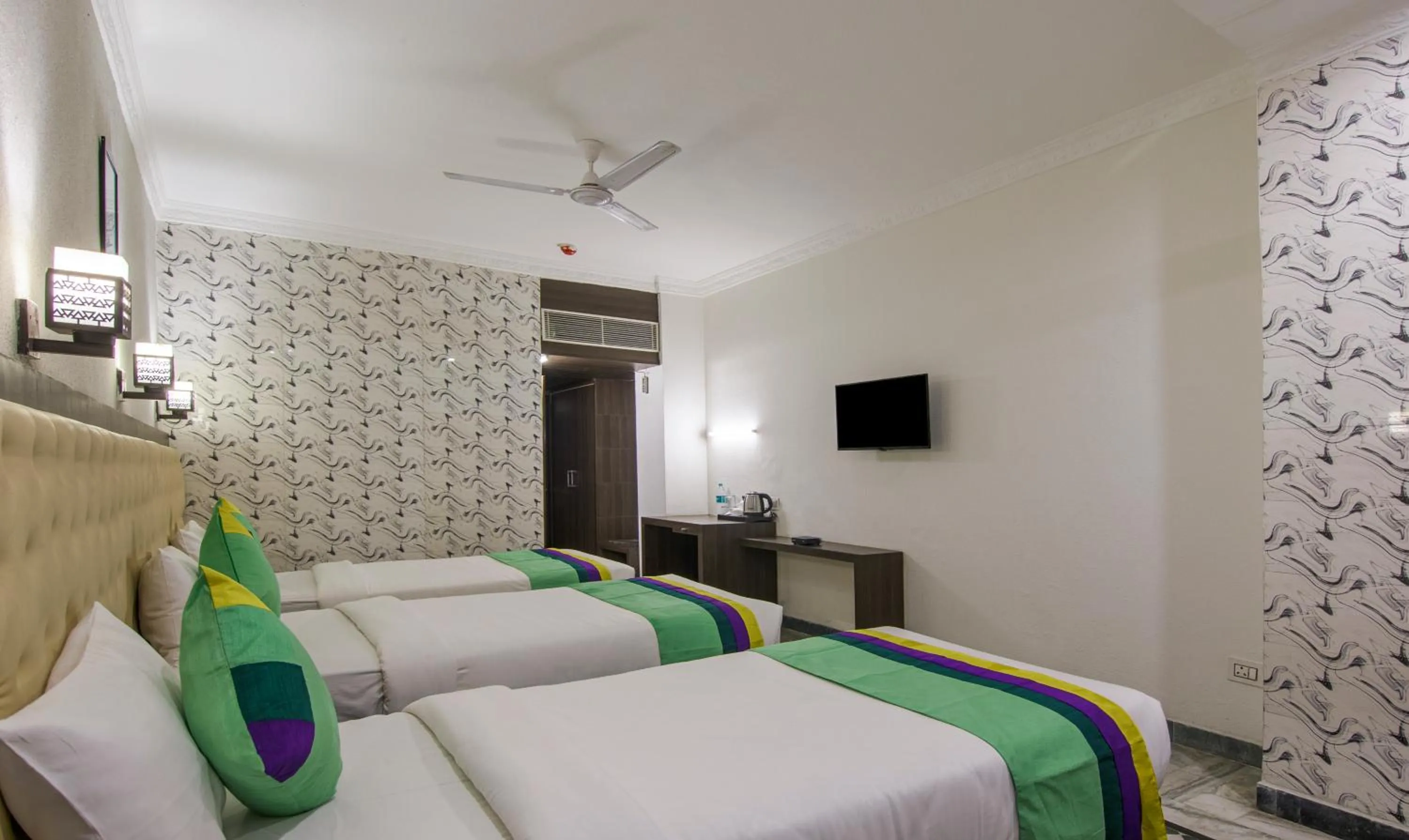 Bed in Treebo Trinetar International