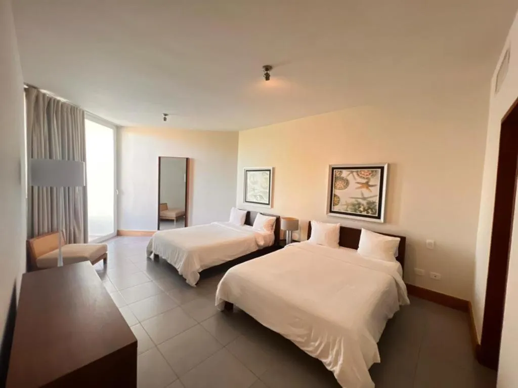 Bed in Ultravioleta Boutique Residences