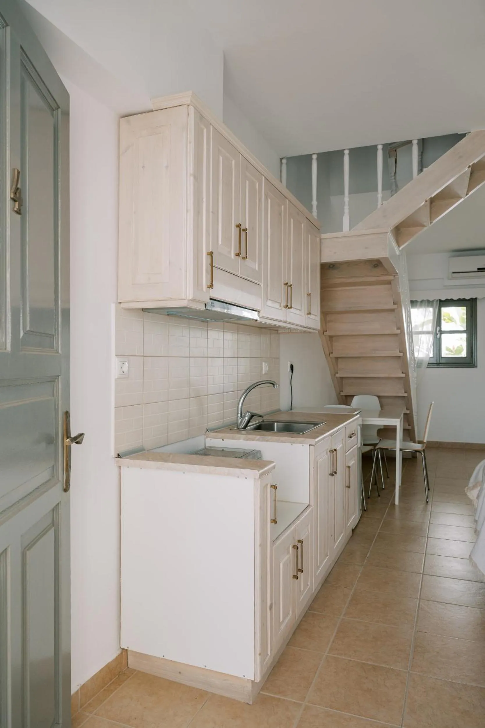 Kitchen or kitchenette in Lindos Harmony Suites