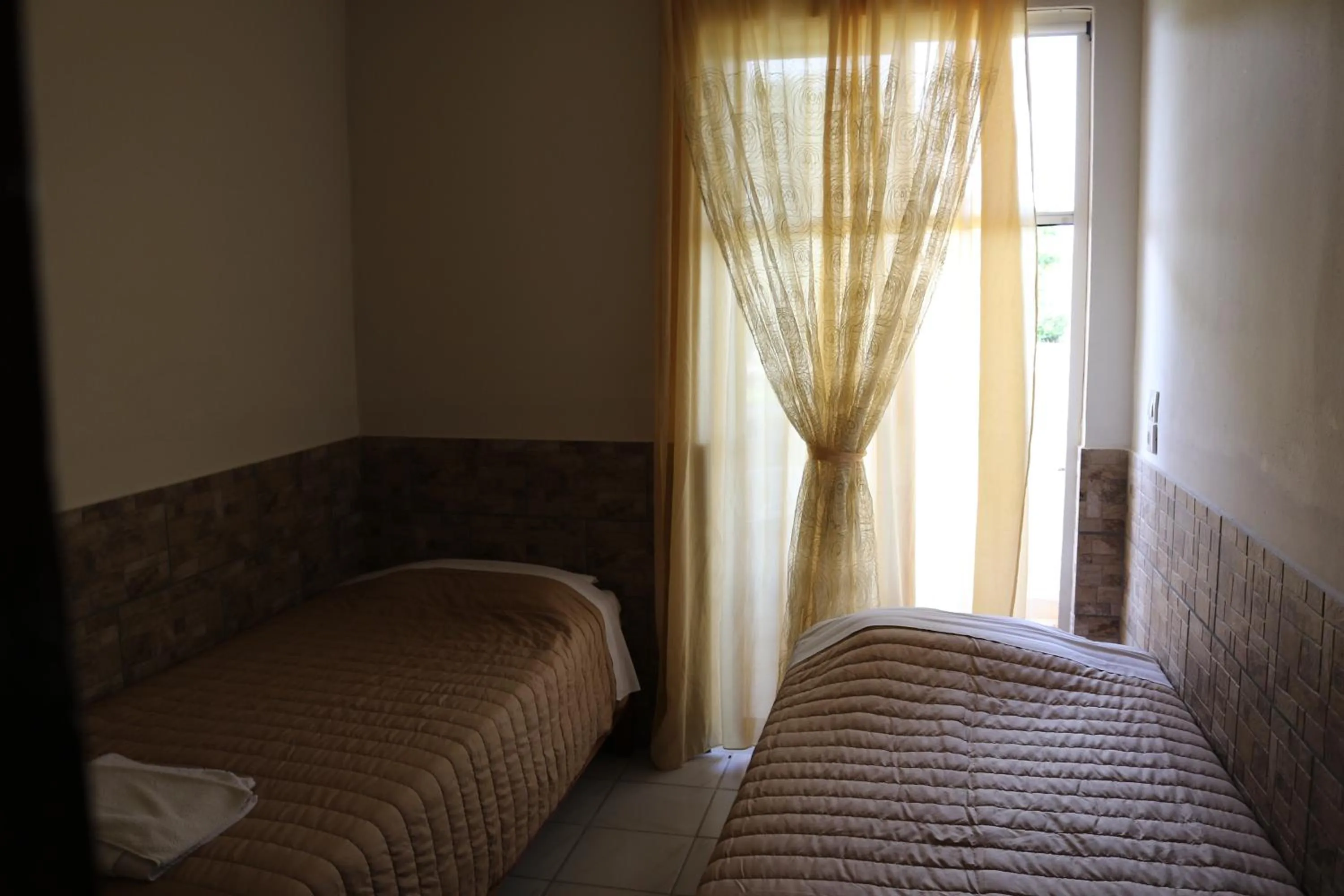 Photo of the whole room, Bed in Golden Sun