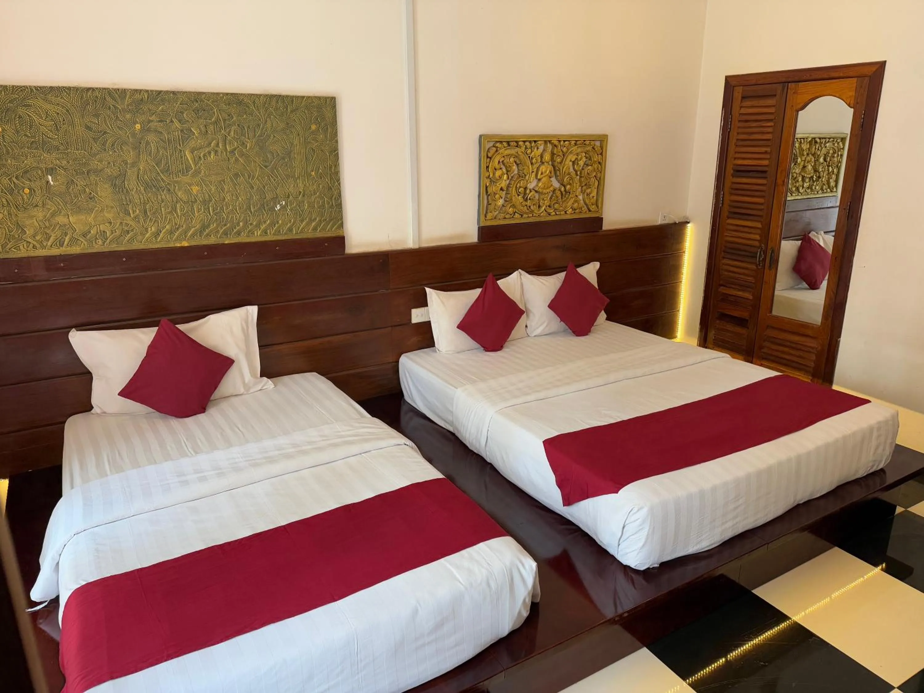 Bed in Asanak D'Angkor Boutique Hotel