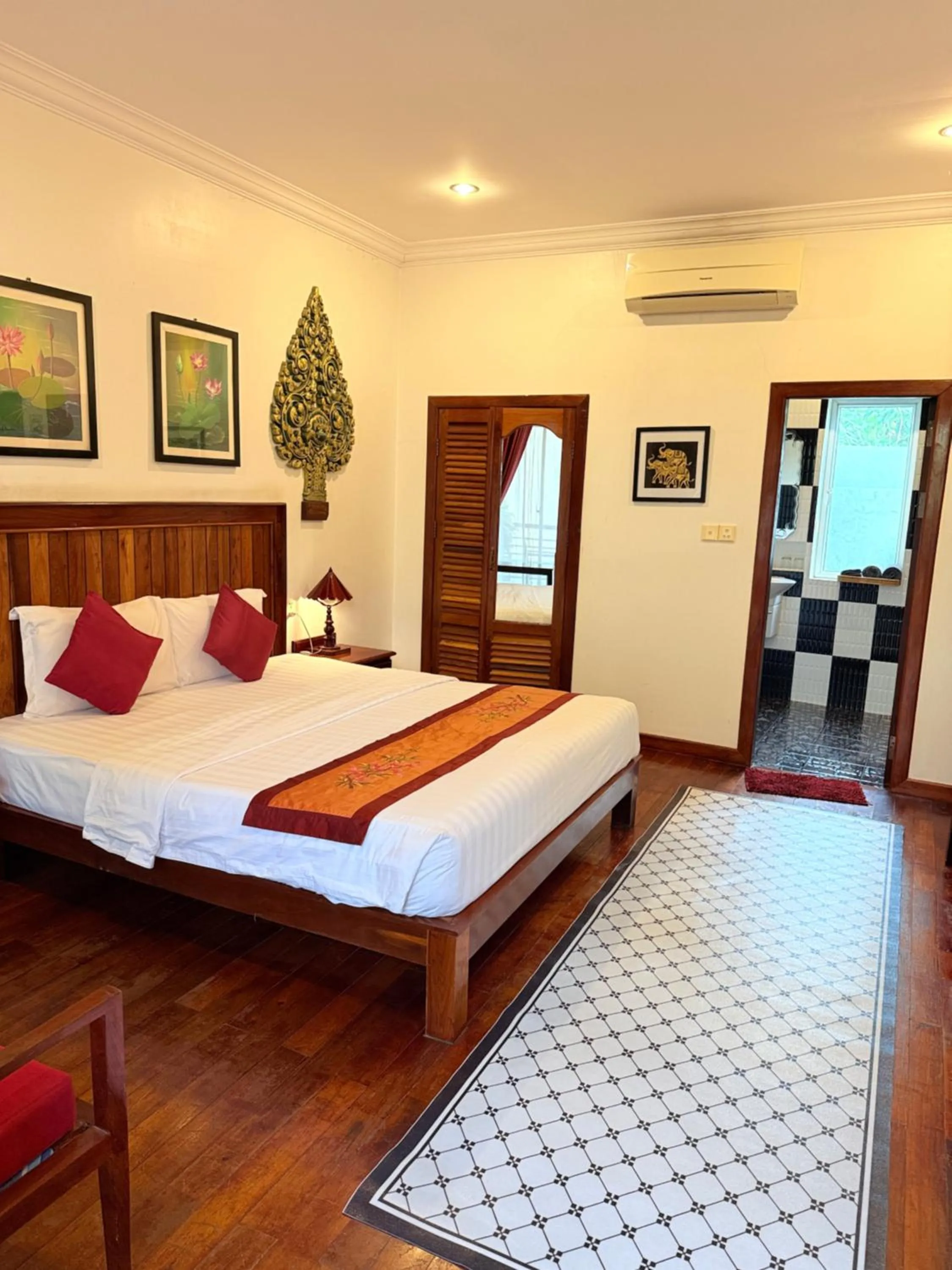 Bed in Asanak D'Angkor Boutique Hotel