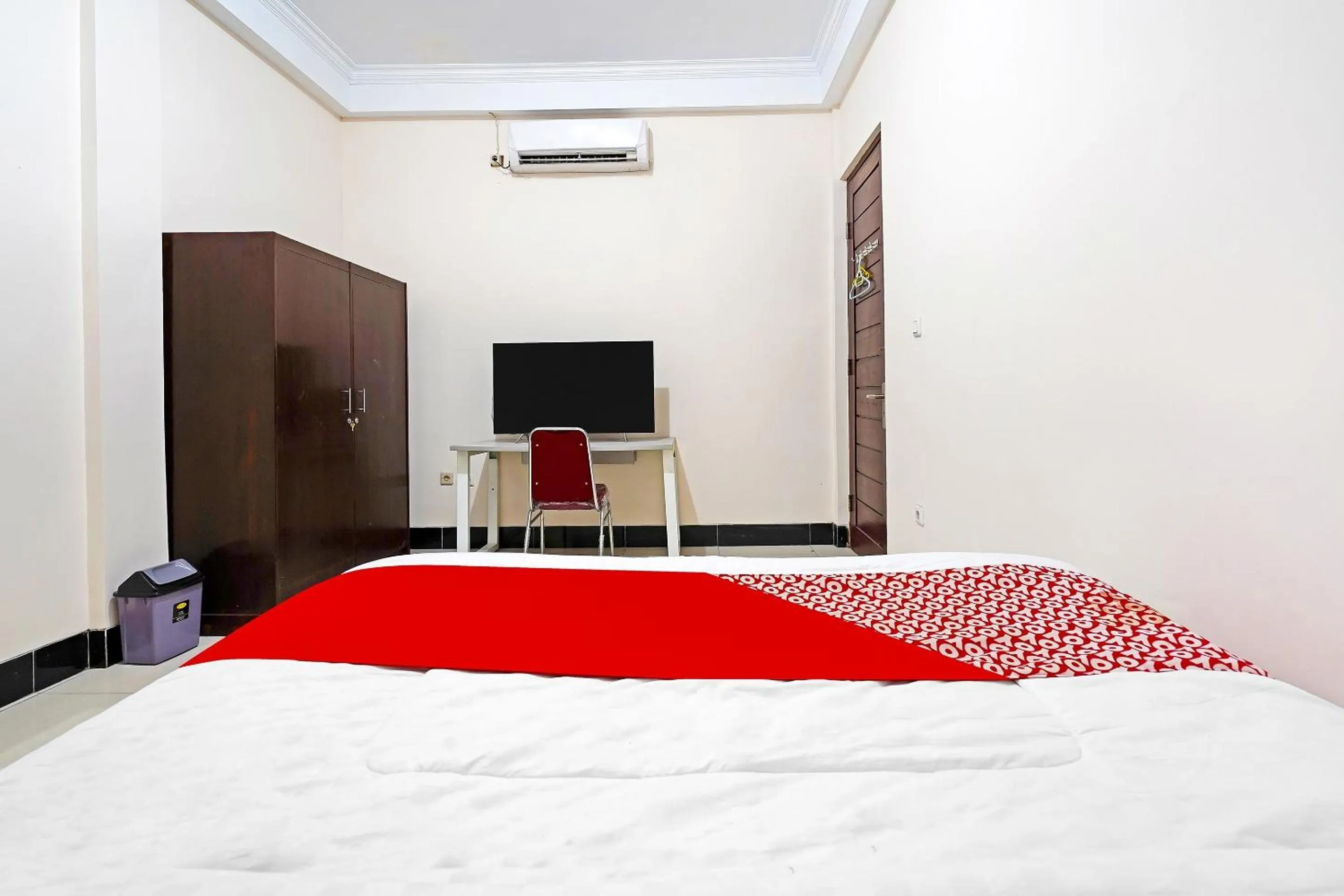 Bedroom in Hotel O Jawara Guest House Syariah