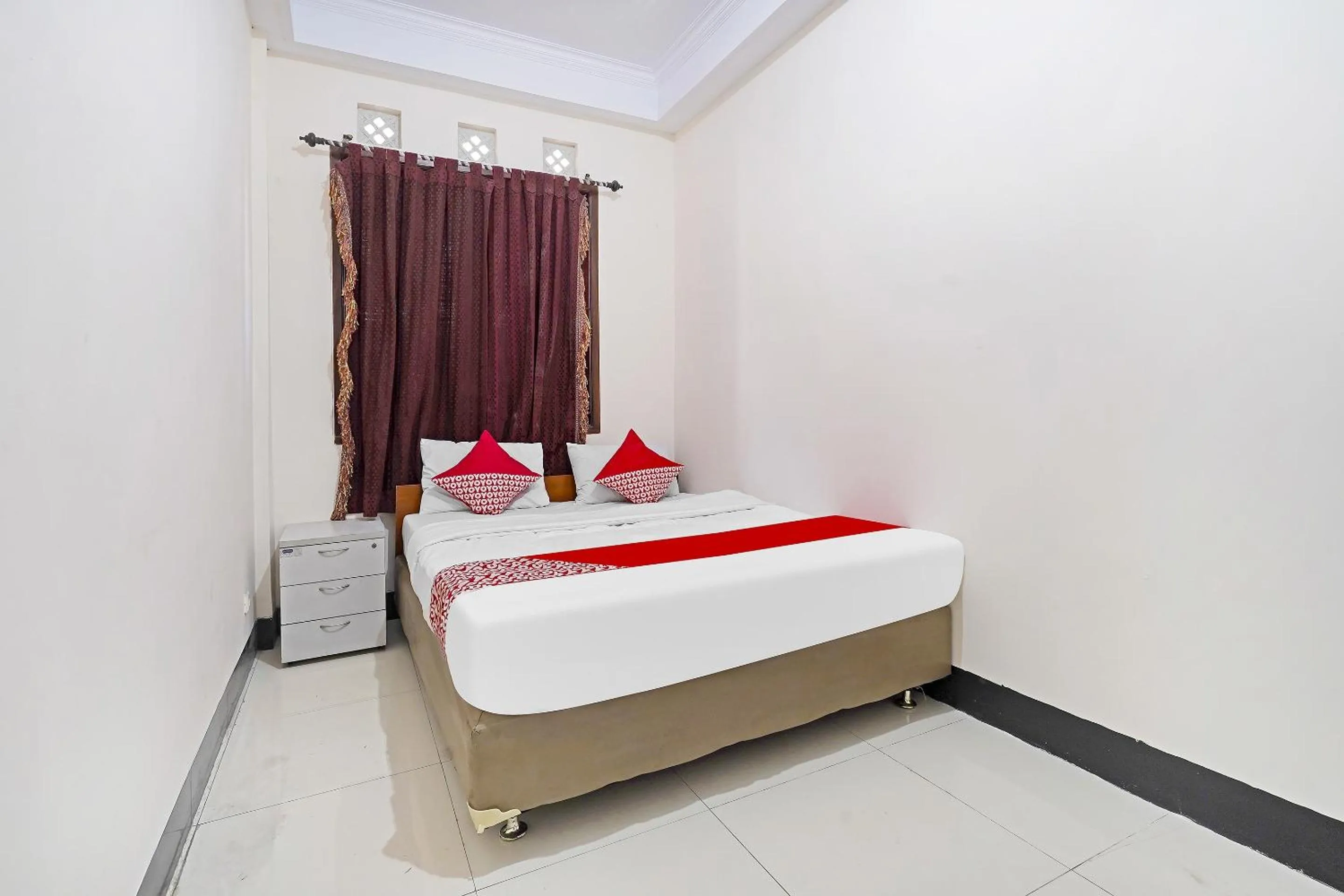 Bedroom in Hotel O Jawara Guest House Syariah