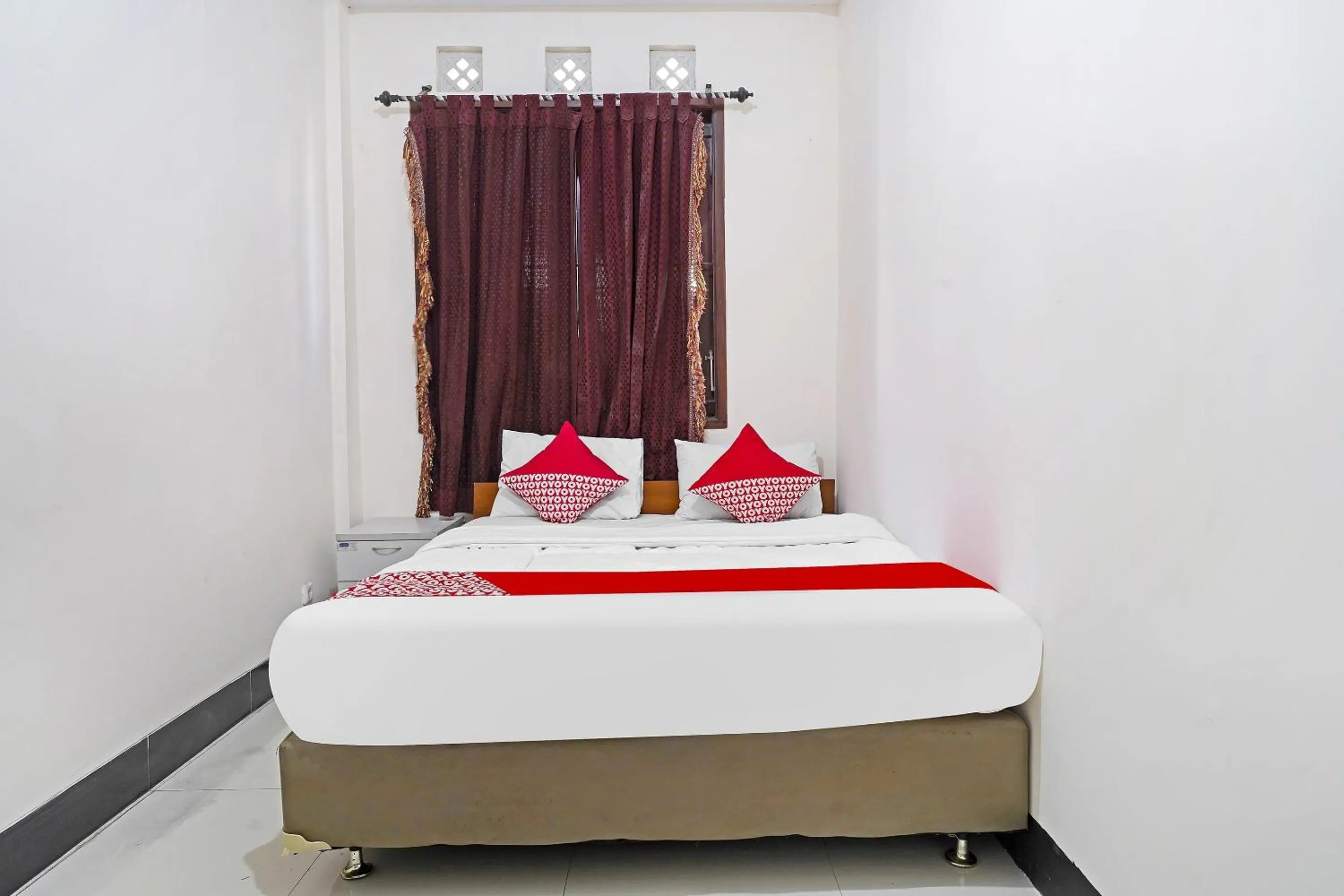 Bedroom in Hotel O Jawara Guest House Syariah