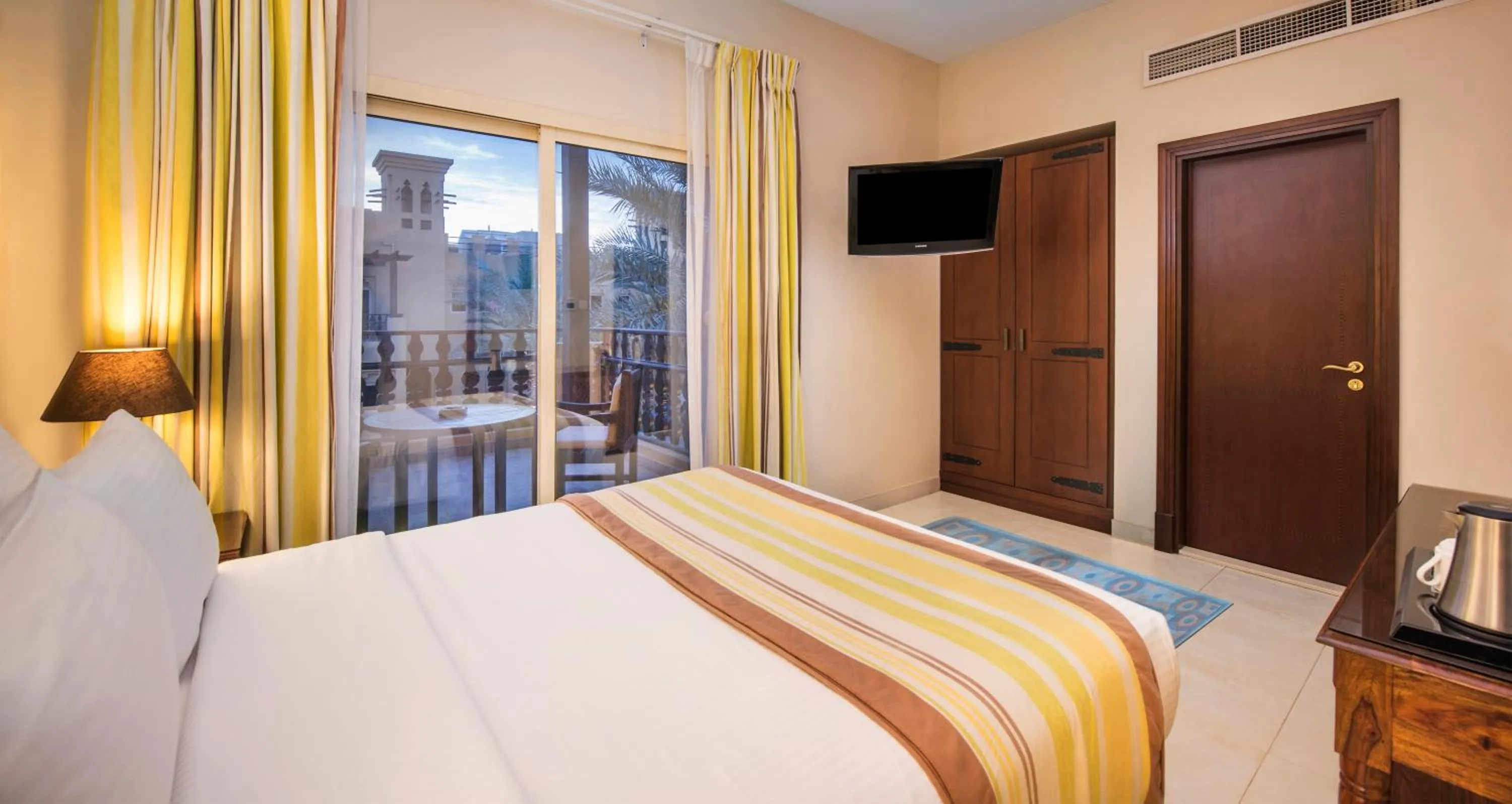 Photo of the whole room, Bed in Al Hamra Village Hotel