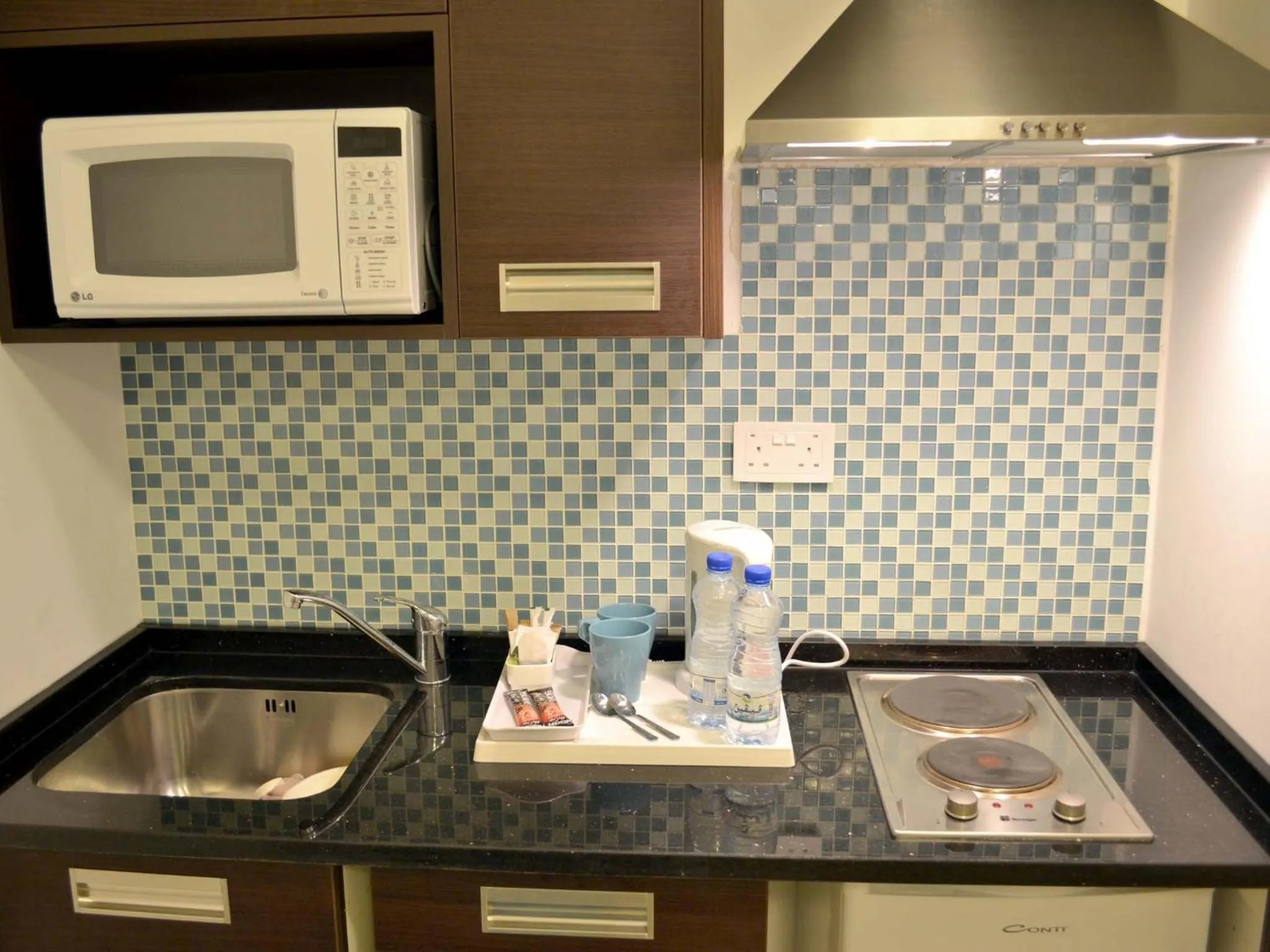 Kitchen or kitchenette in Khuttar Apartment