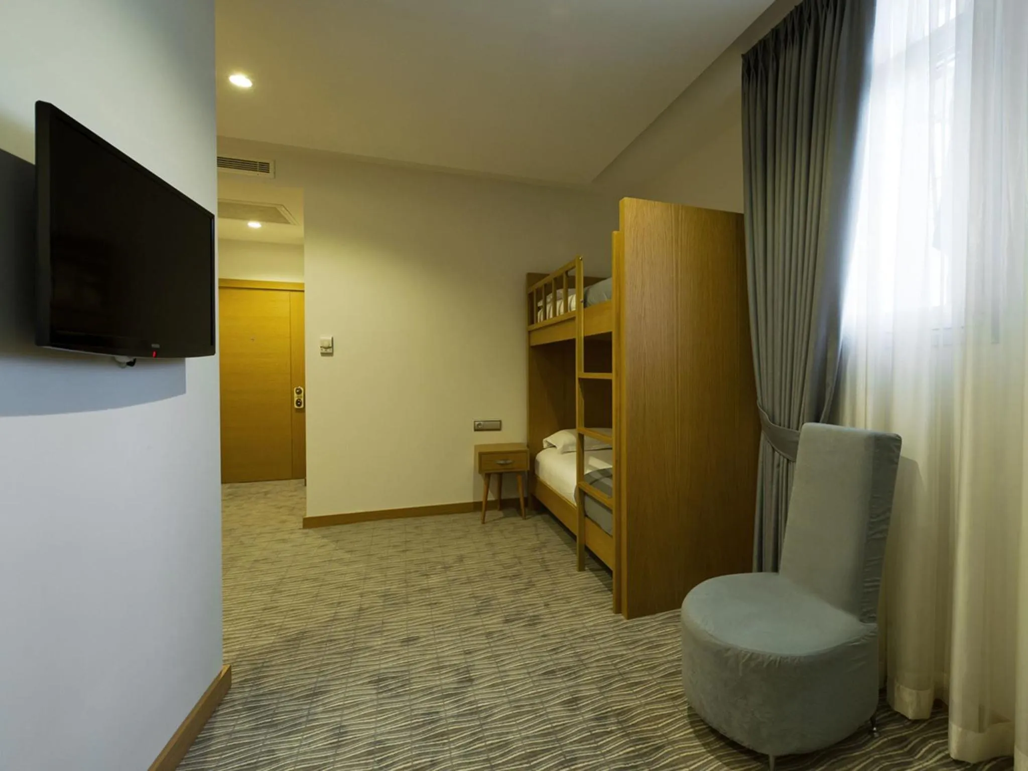 Bedroom, TV/Entertainment Center in Hotel Olimpiyat