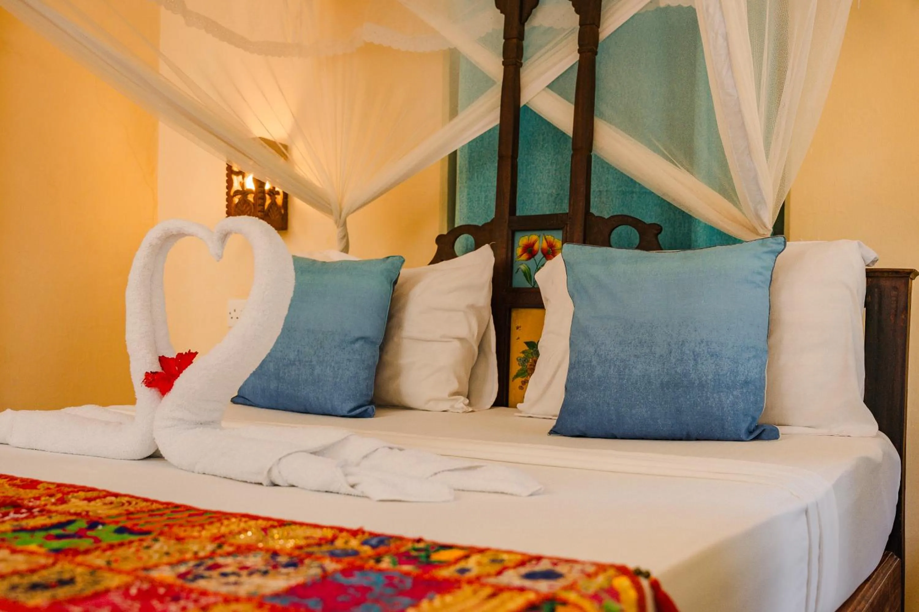 Bed in Emerald Palm Boutique Hotel