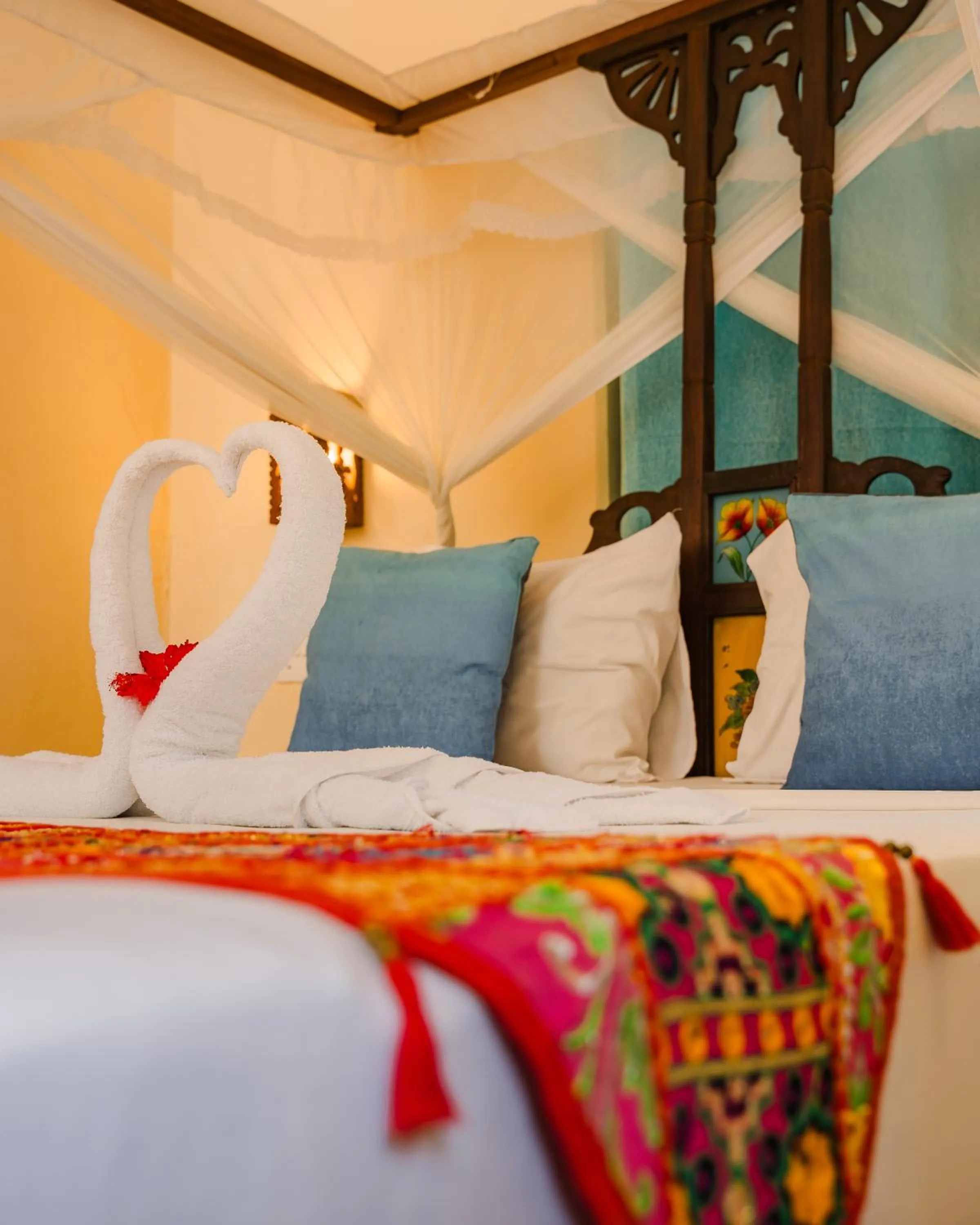 Bed in Emerald Palm Boutique Hotel