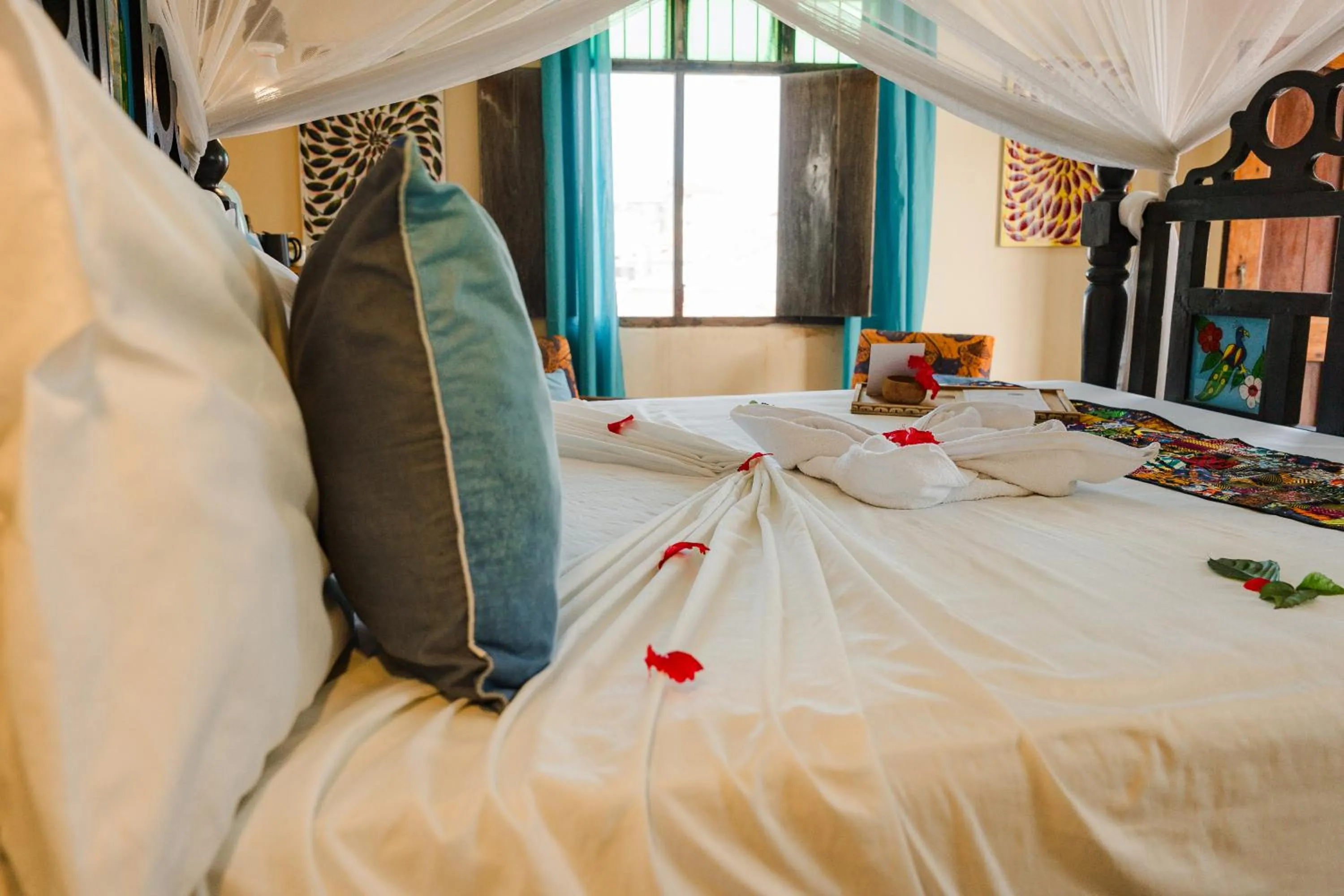 Bed in Emerald Palm Boutique Hotel