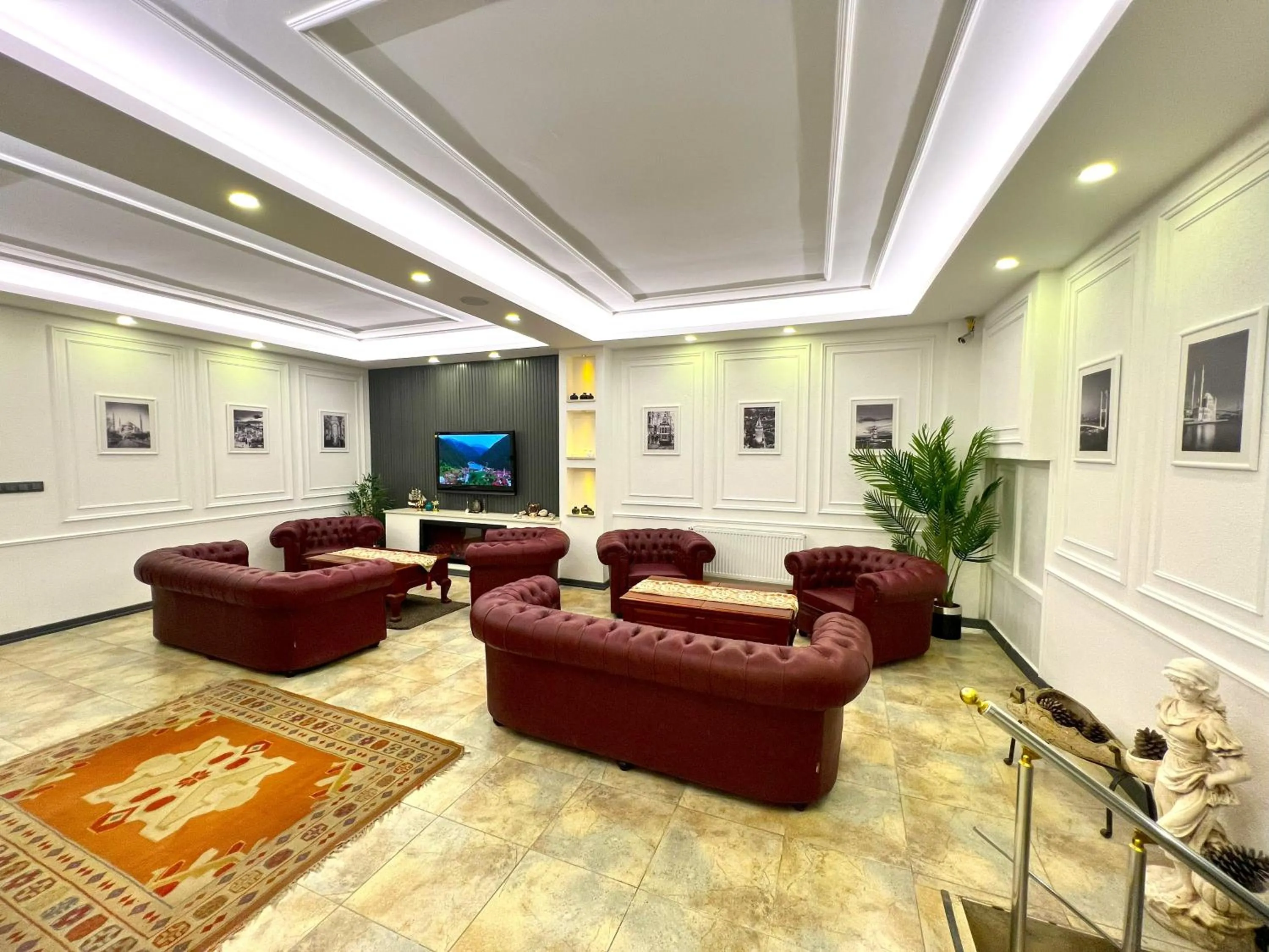 Communal lounge/ TV room in Angel's Home Hotel - Angel Group Hotels