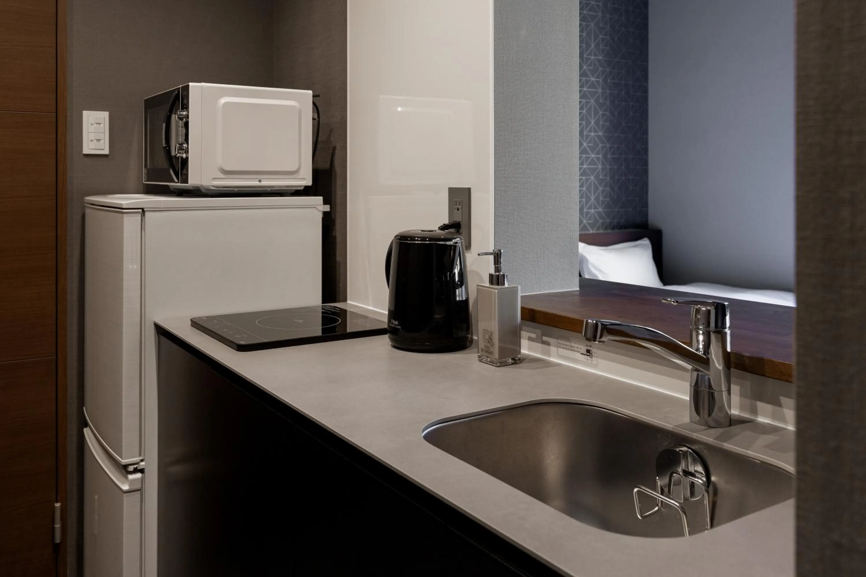 Kitchen or kitchenette in COCOSHUKU Shinjuku-Hanazono