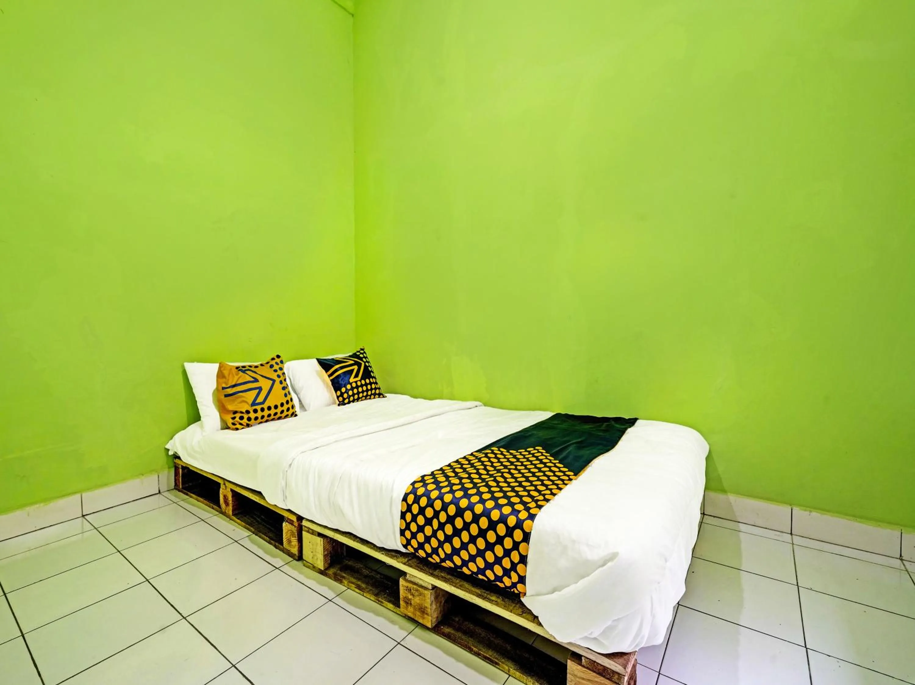 Bedroom in SPOT ON 91325 Pondok Hijau Guest House Syariah