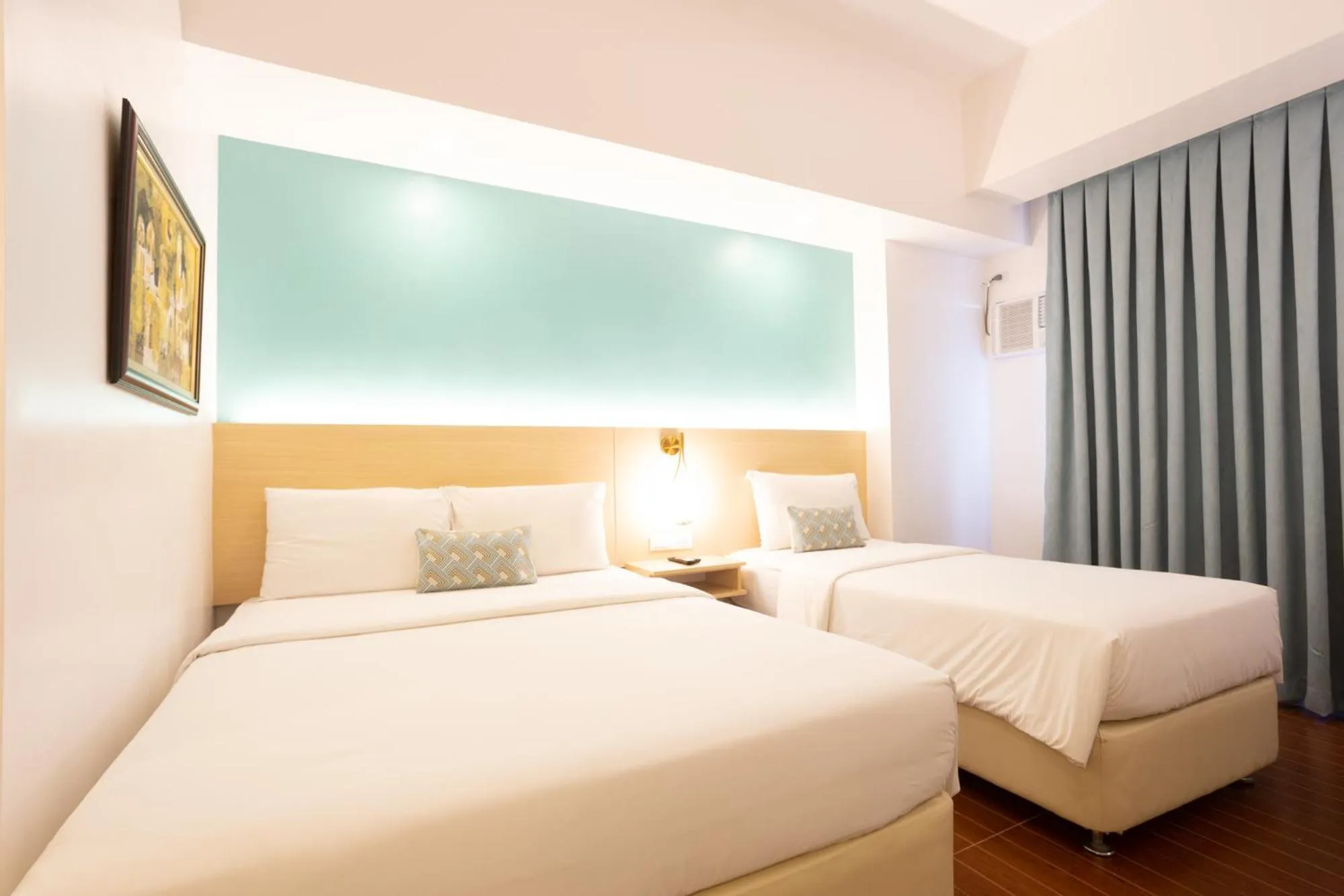 Bed in Allure Hotel & Suites