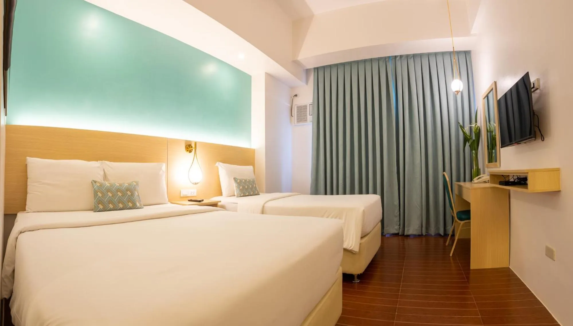 Bed in Allure Hotel & Suites