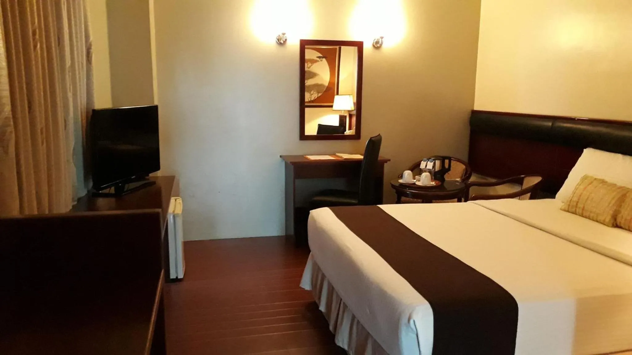 Bed in Allure Hotel & Suites