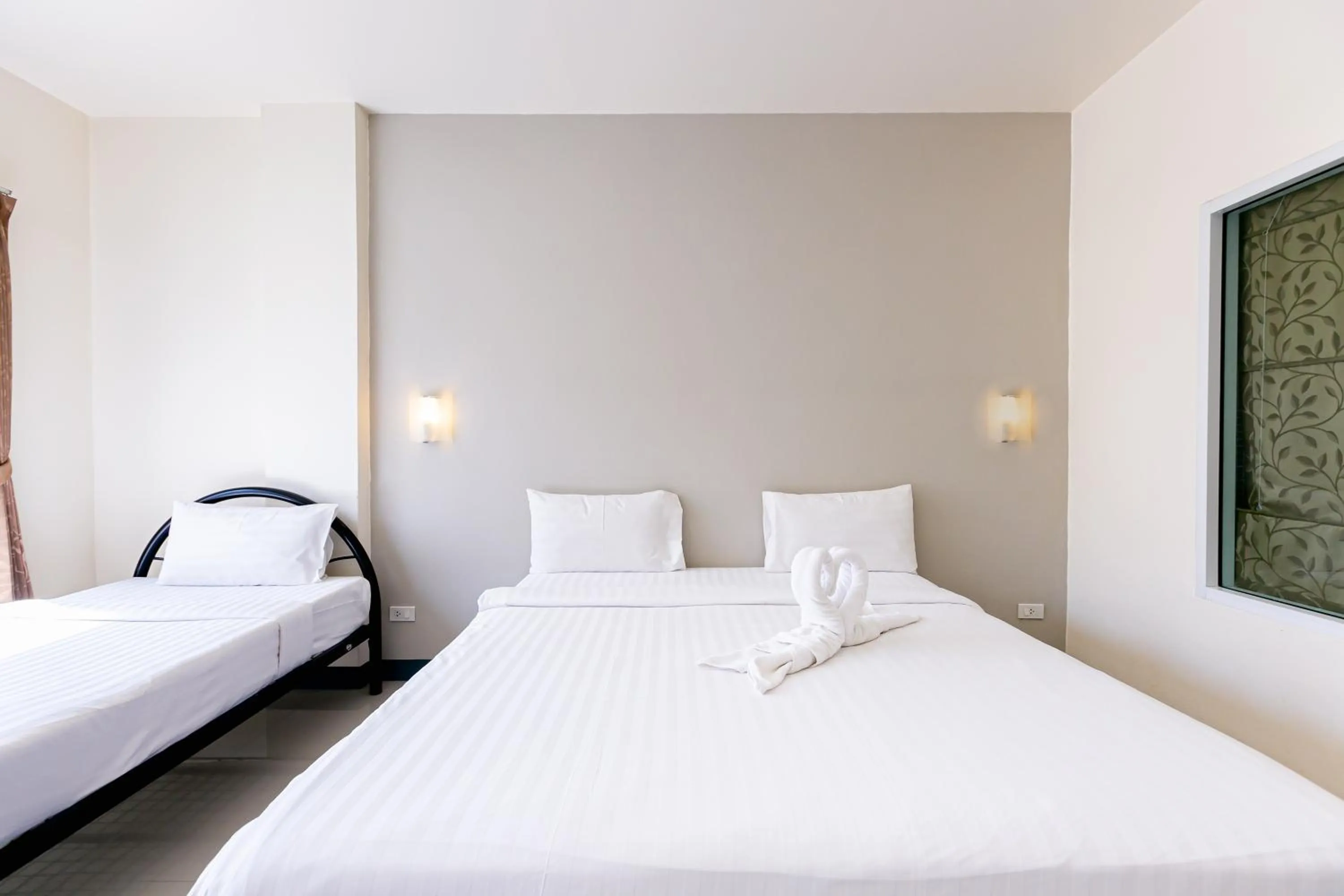 Bed in Panwalee Hotel