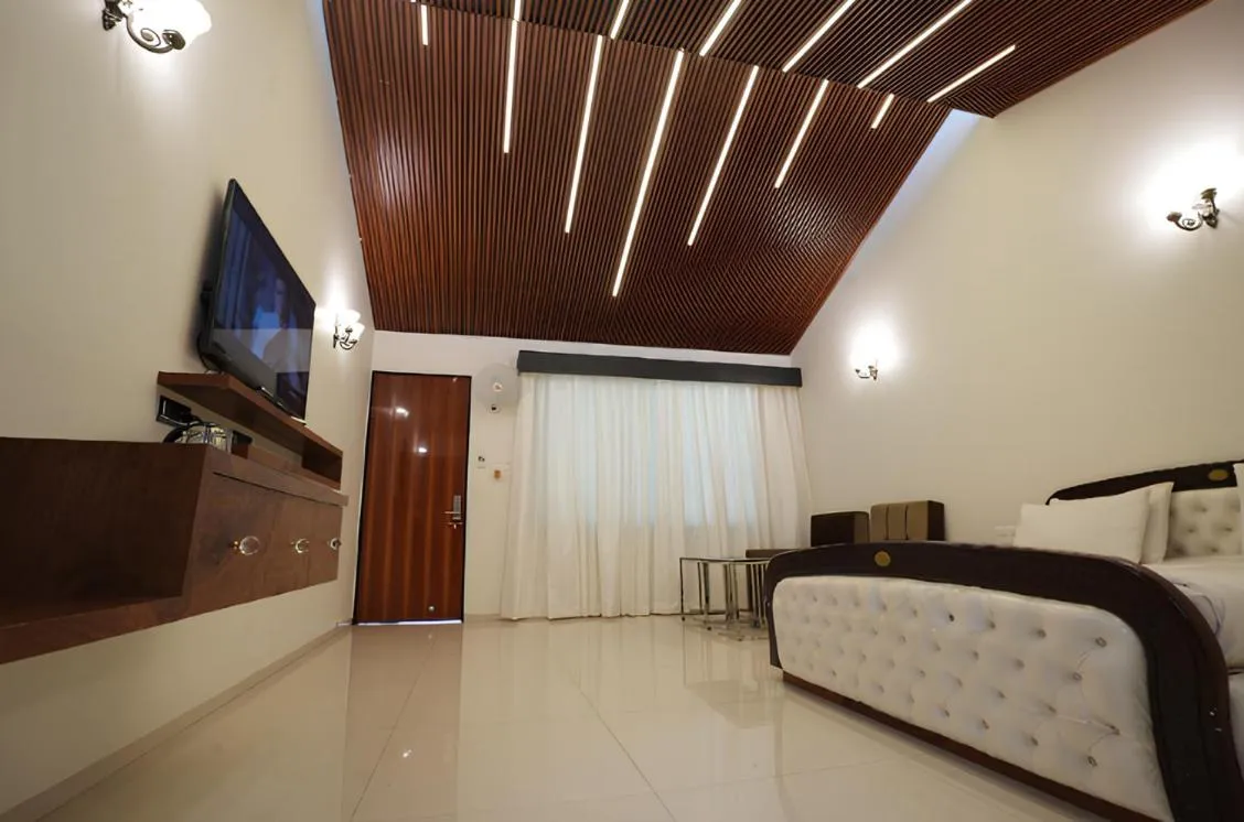 TV and multimedia, Bed in Anand Resort - A luxury Private Pool Resort in Nashik