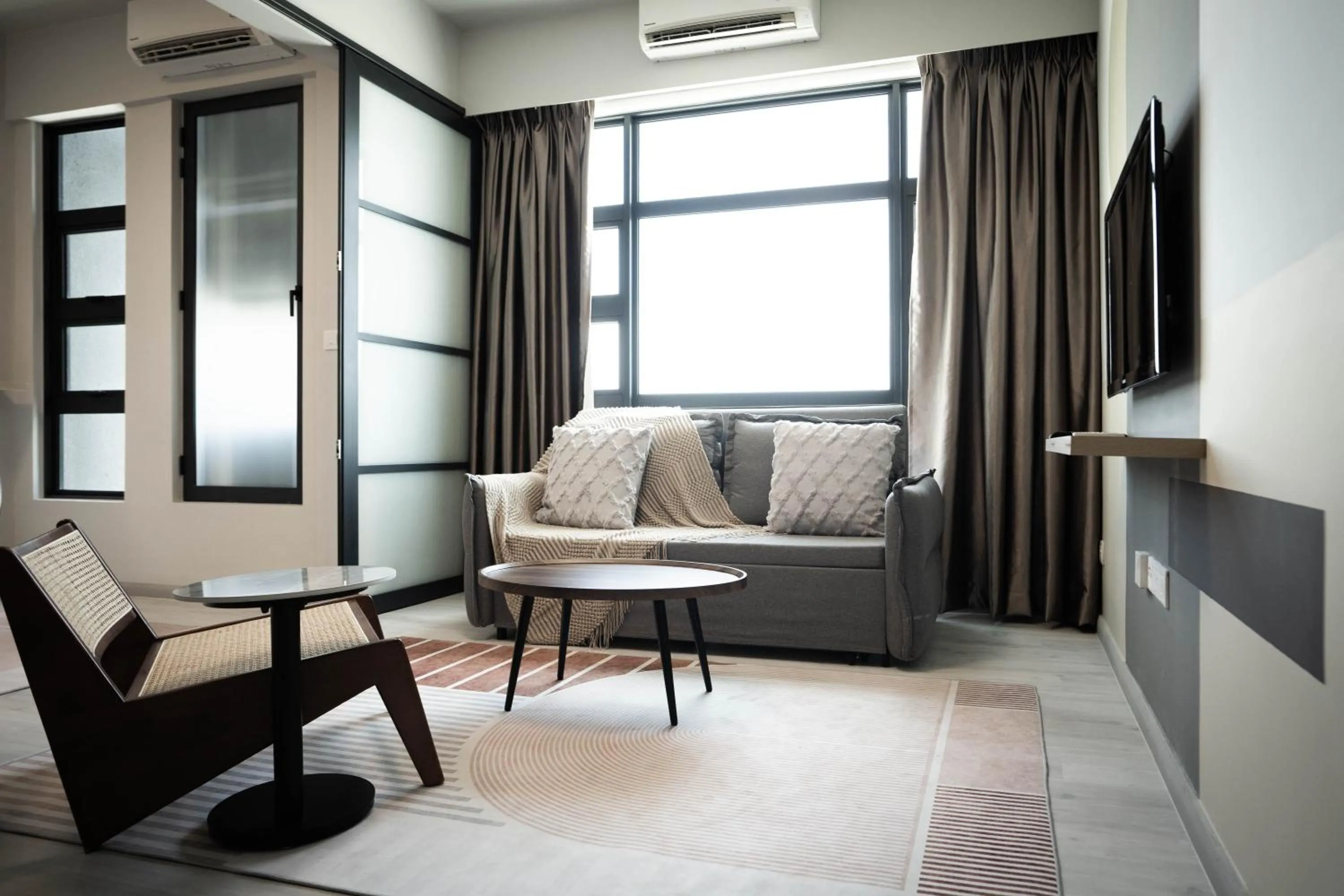 Living room in Jesselton Quay by Pinstay