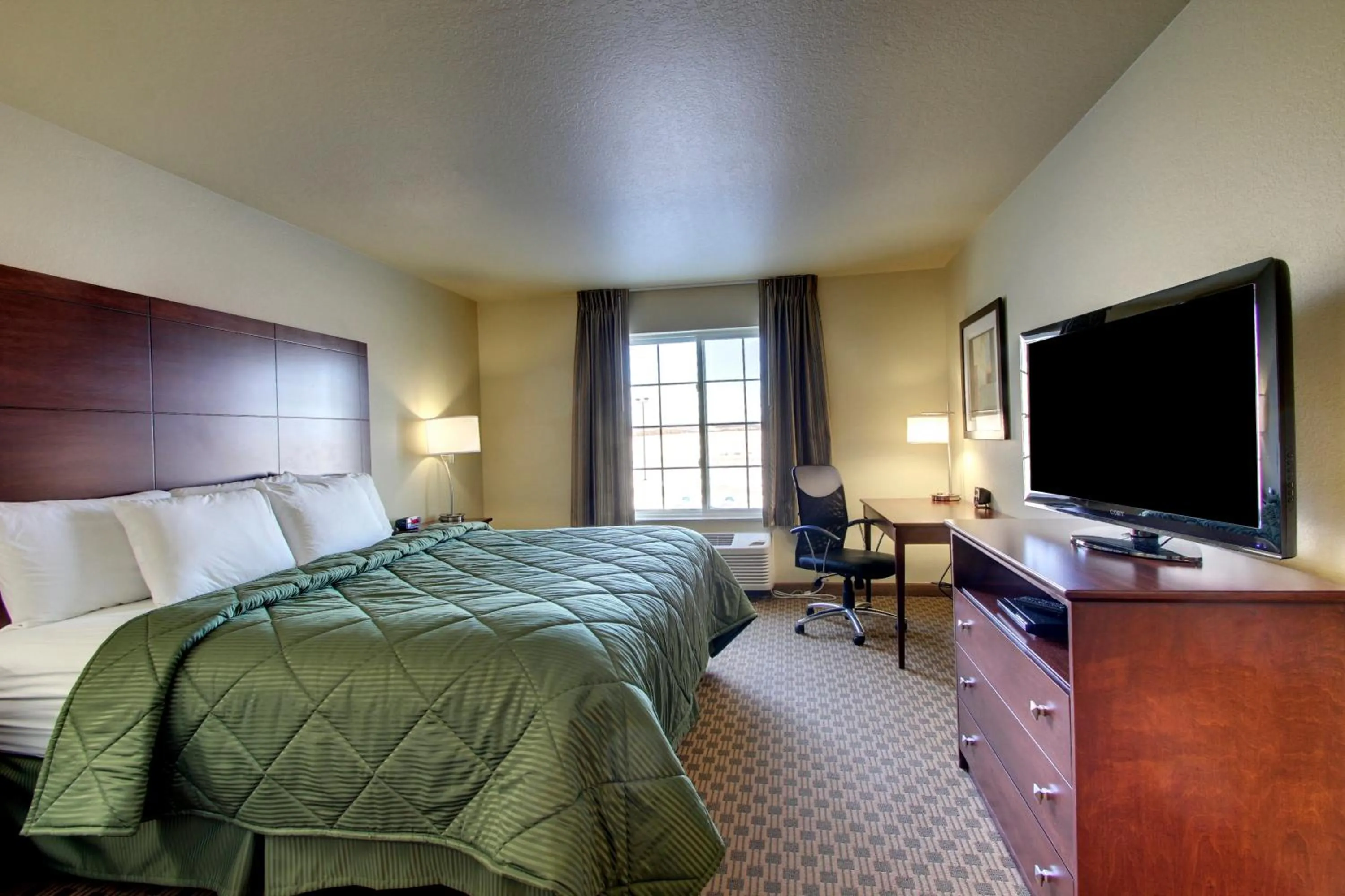Bed in Cobblestone Inn & Suites - Harper
