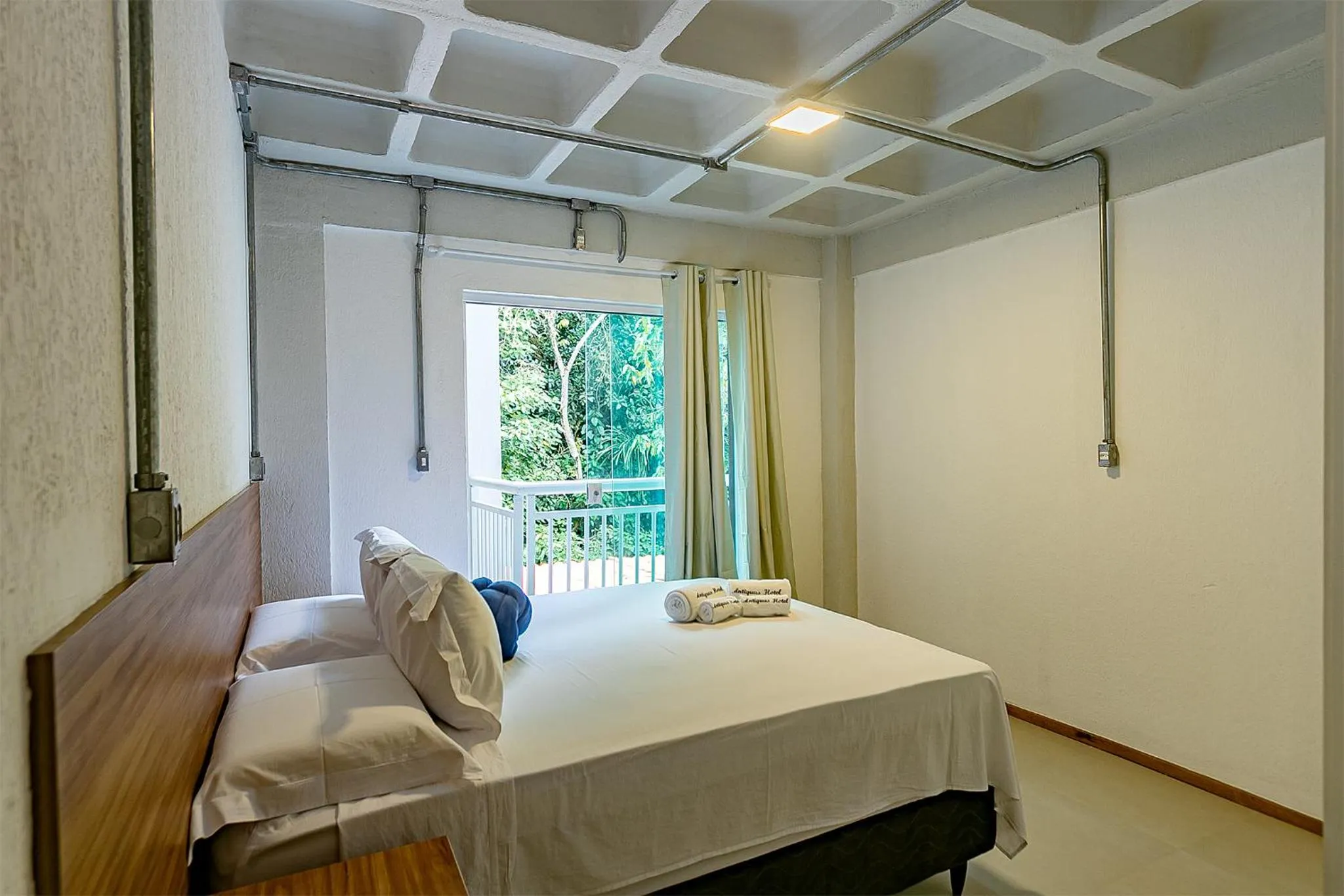 Bed in Antiquus ApartHotel