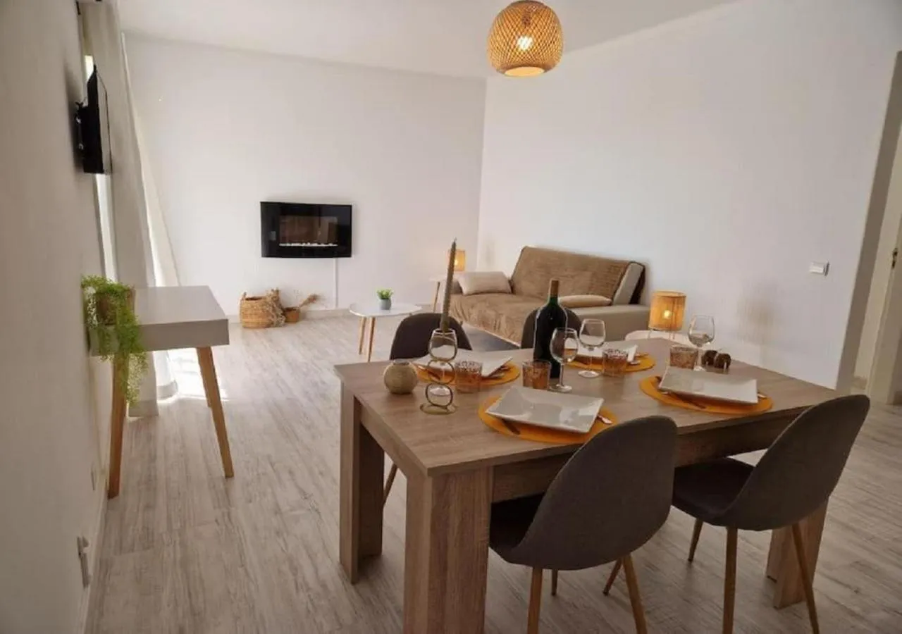 Communal lounge/ TV room in Modern flat with sea view and direct beach access