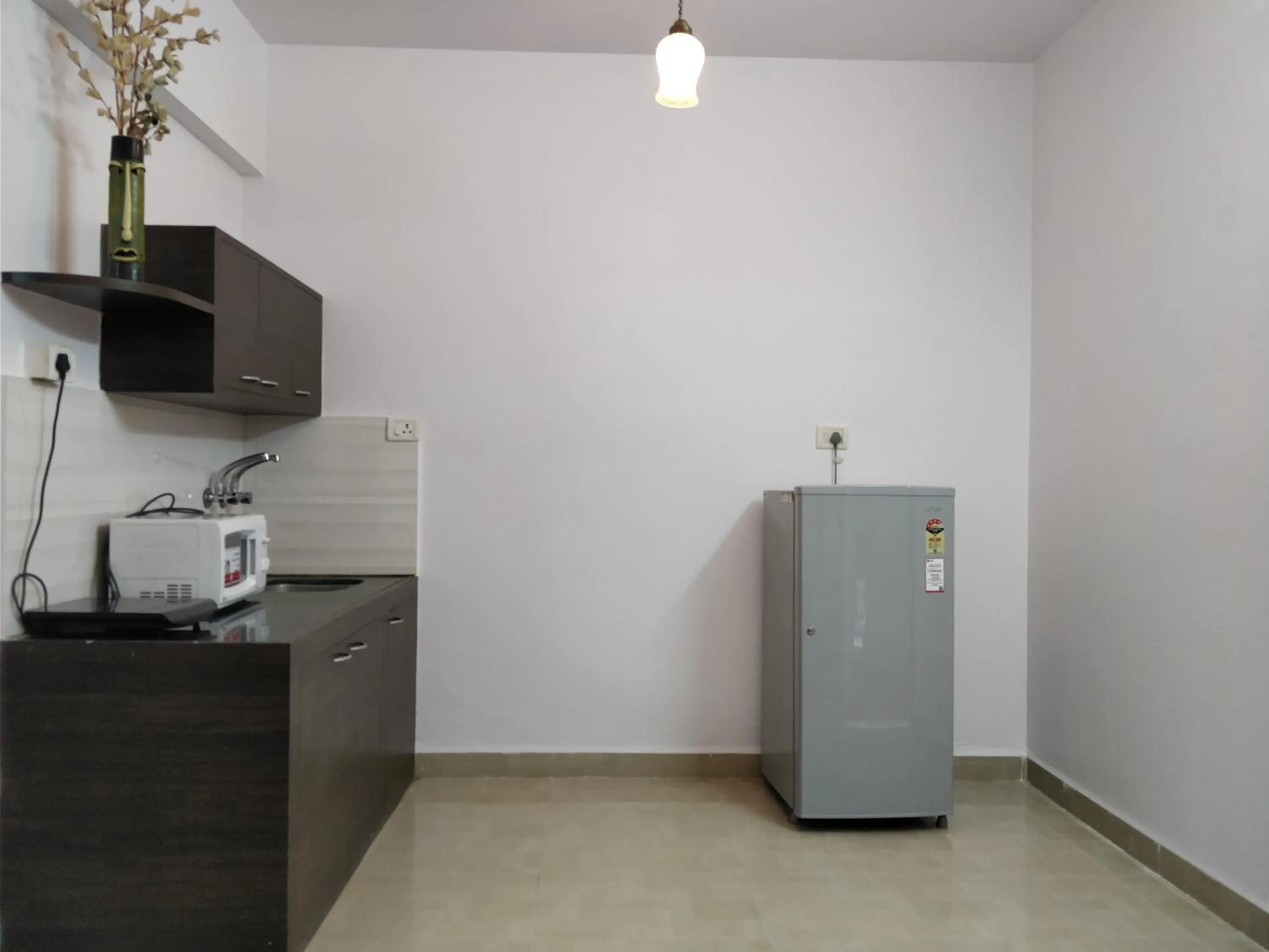 Kitchen or kitchenette in YoYo Goa, The Apartment Hotel