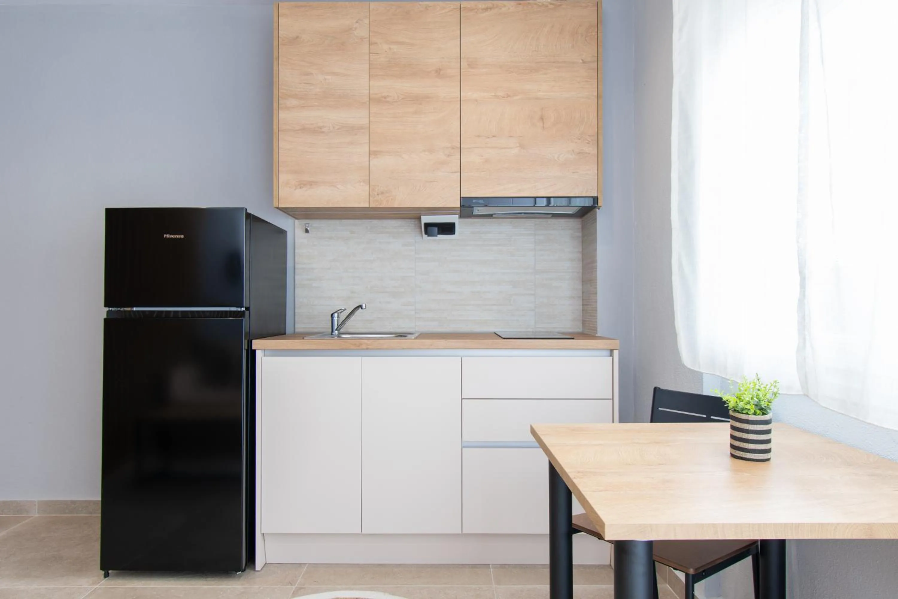 Kitchen or kitchenette in Unique Aura Luxury Studios