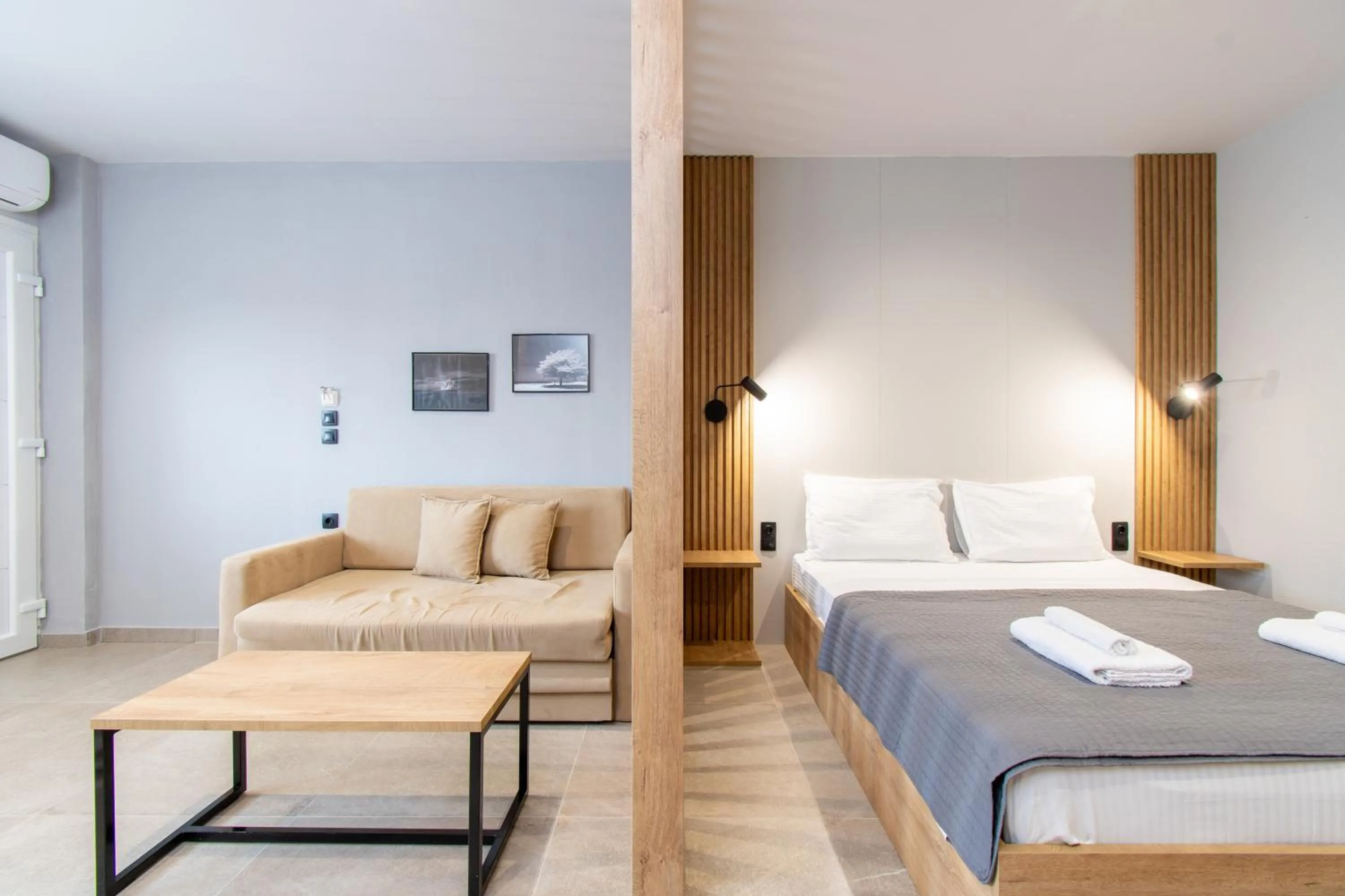 Living room, Bed in Unique Aura Luxury Studios