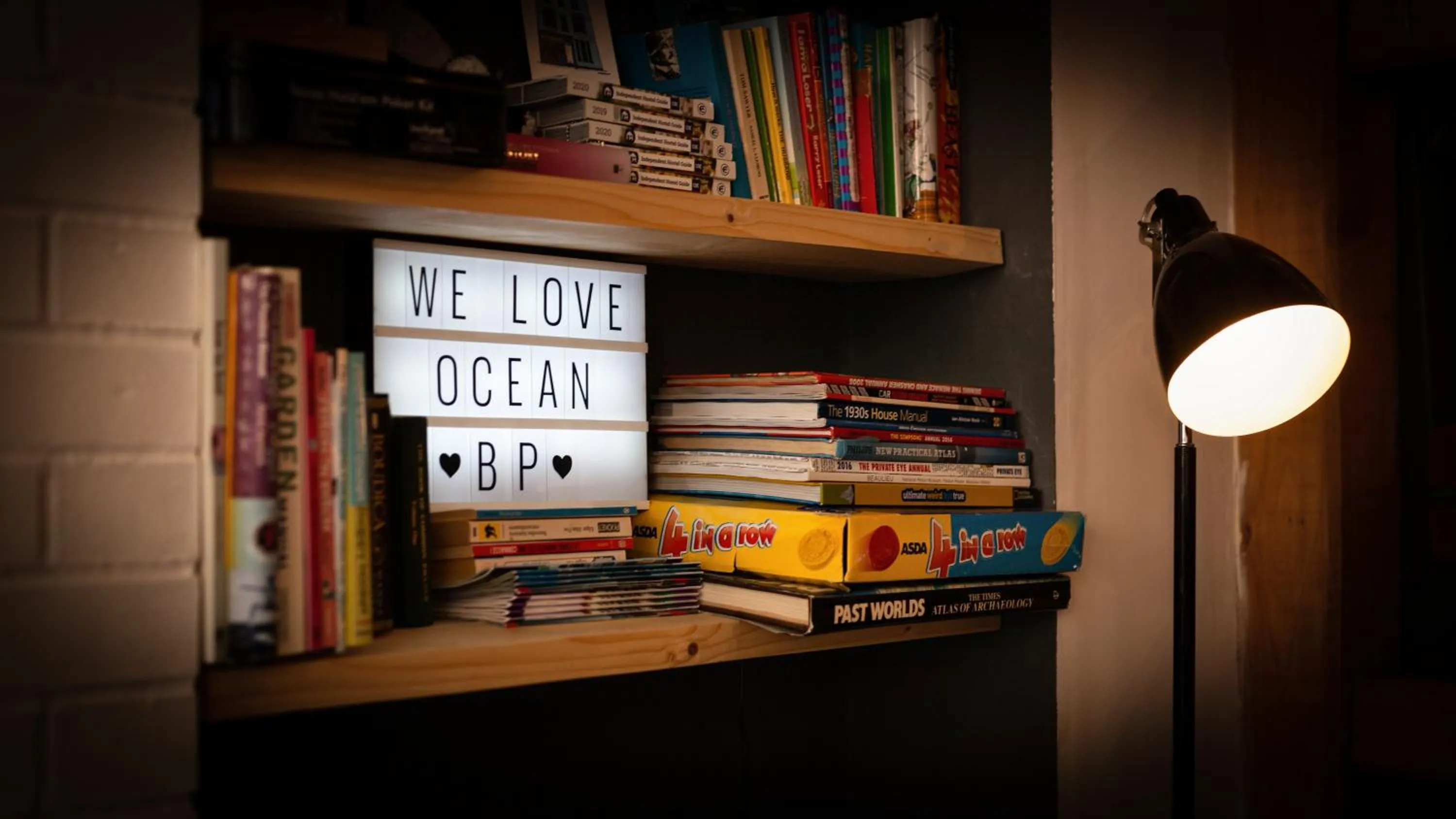 Communal lounge/ TV room in Ocean Backpackers self-catering hostel