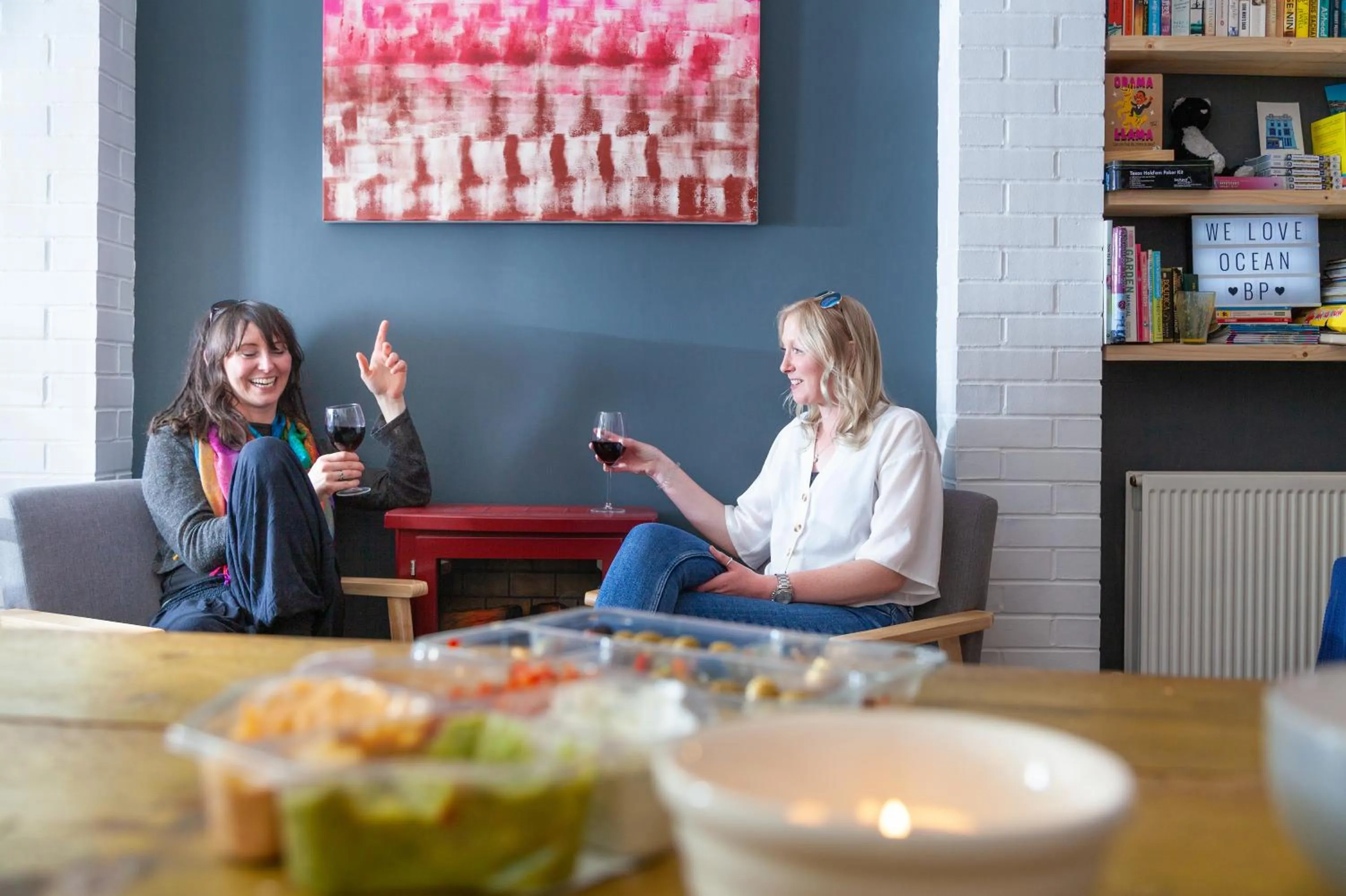 Communal lounge/ TV room in Ocean Backpackers self-catering hostel