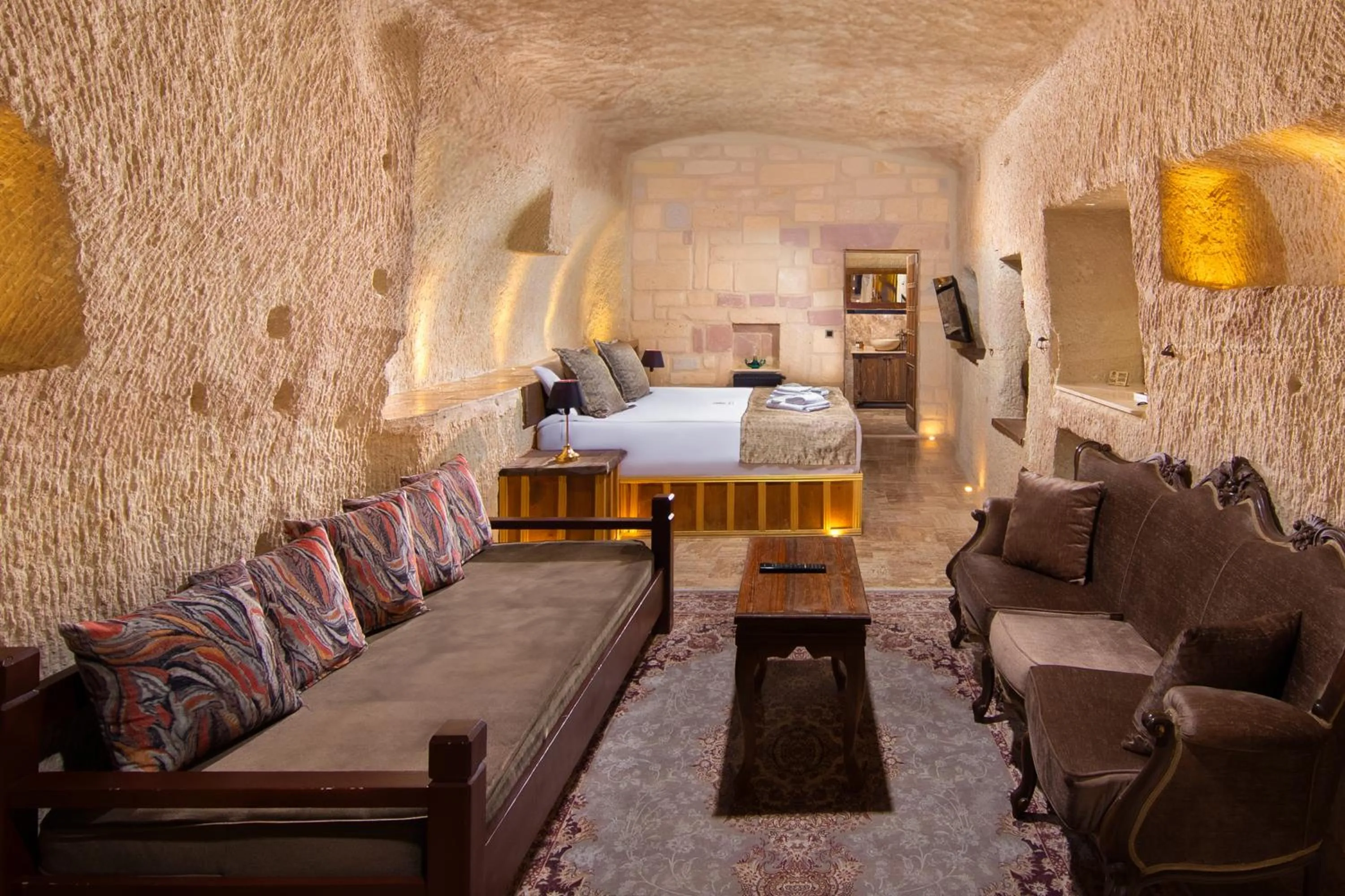 Photo of the whole room, Bed in Dionysos Cave Cappadocia Hotel