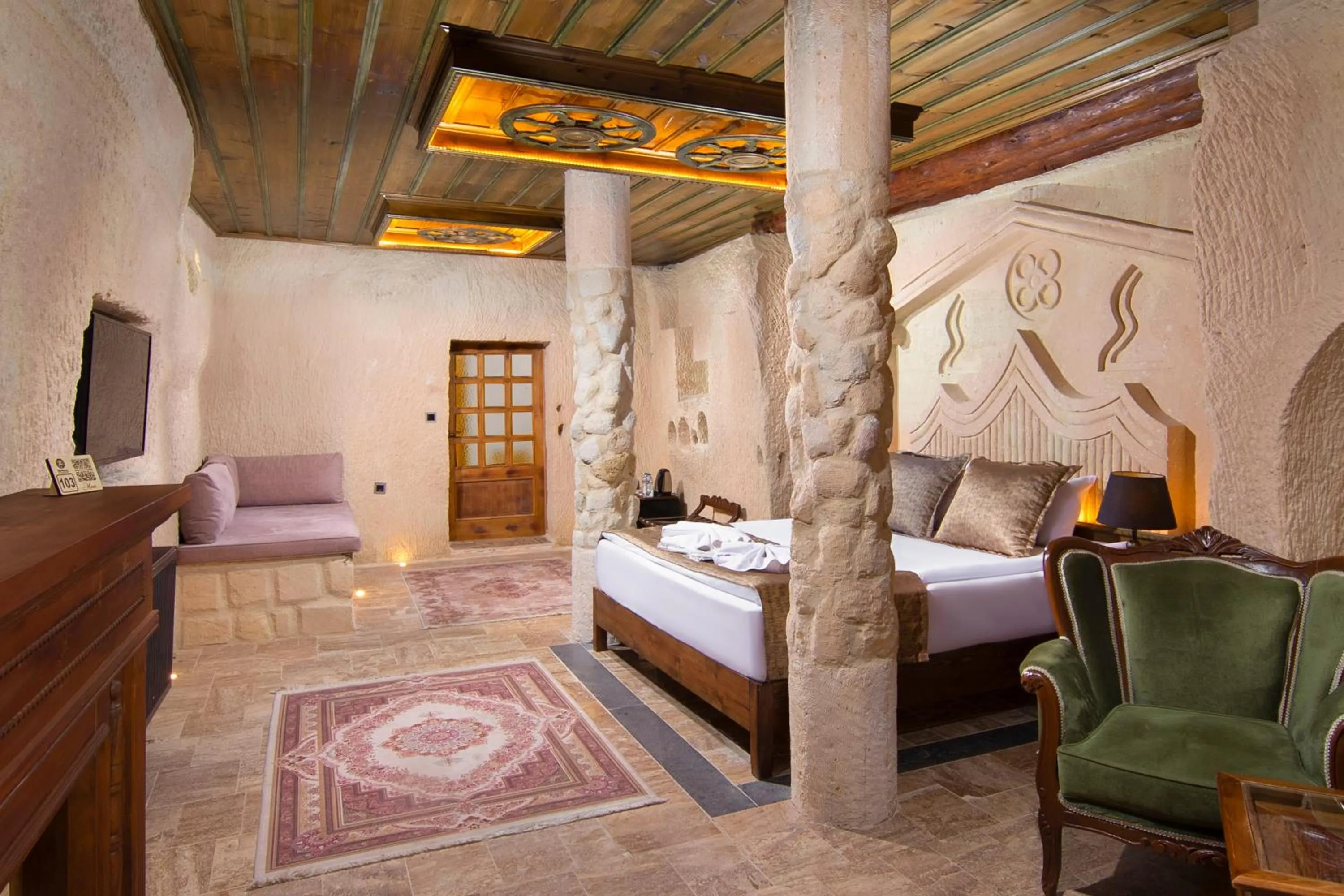 Photo of the whole room, Bed in Dionysos Cave Cappadocia Hotel