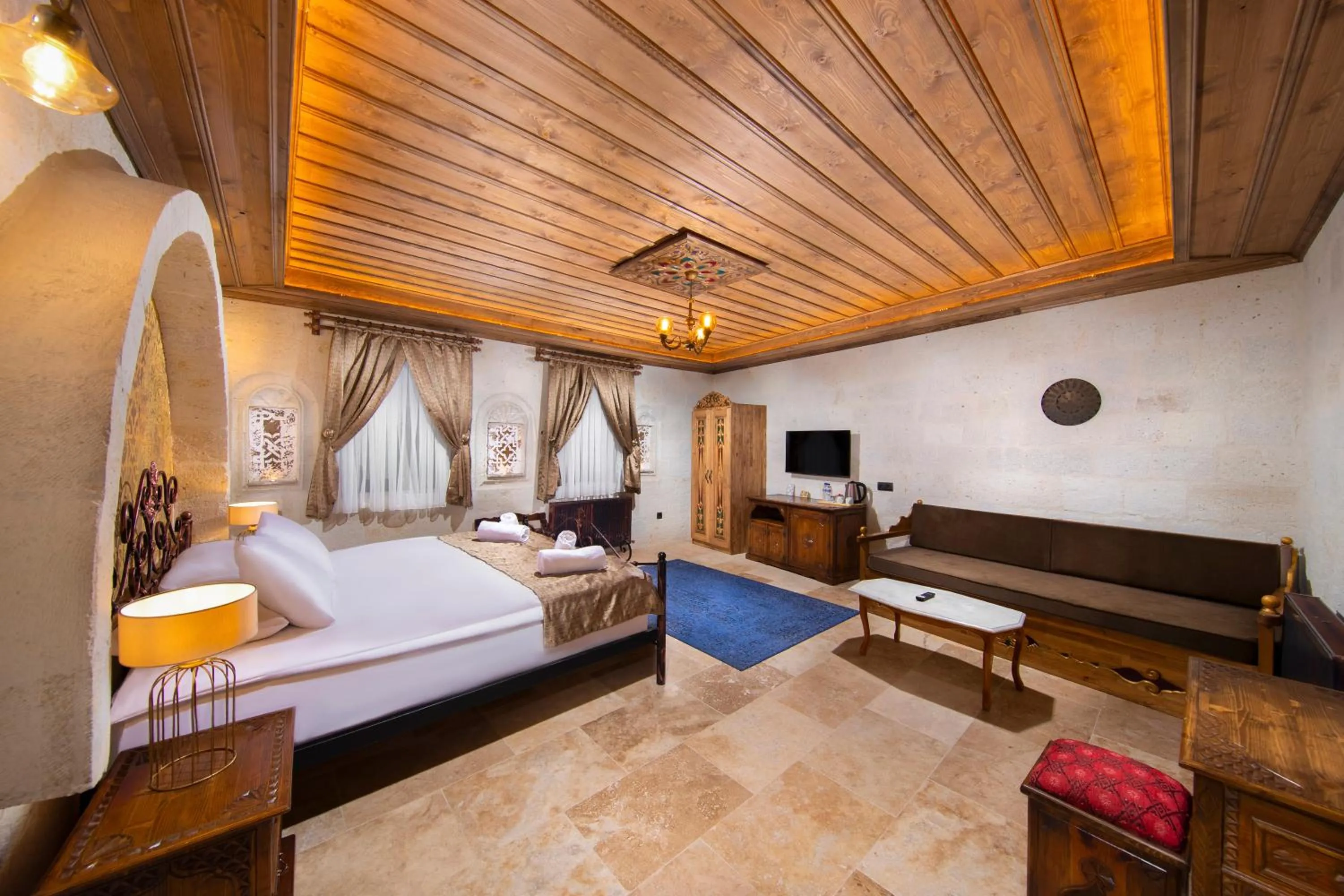 Photo of the whole room, Bed in Dionysos Cave Cappadocia Hotel