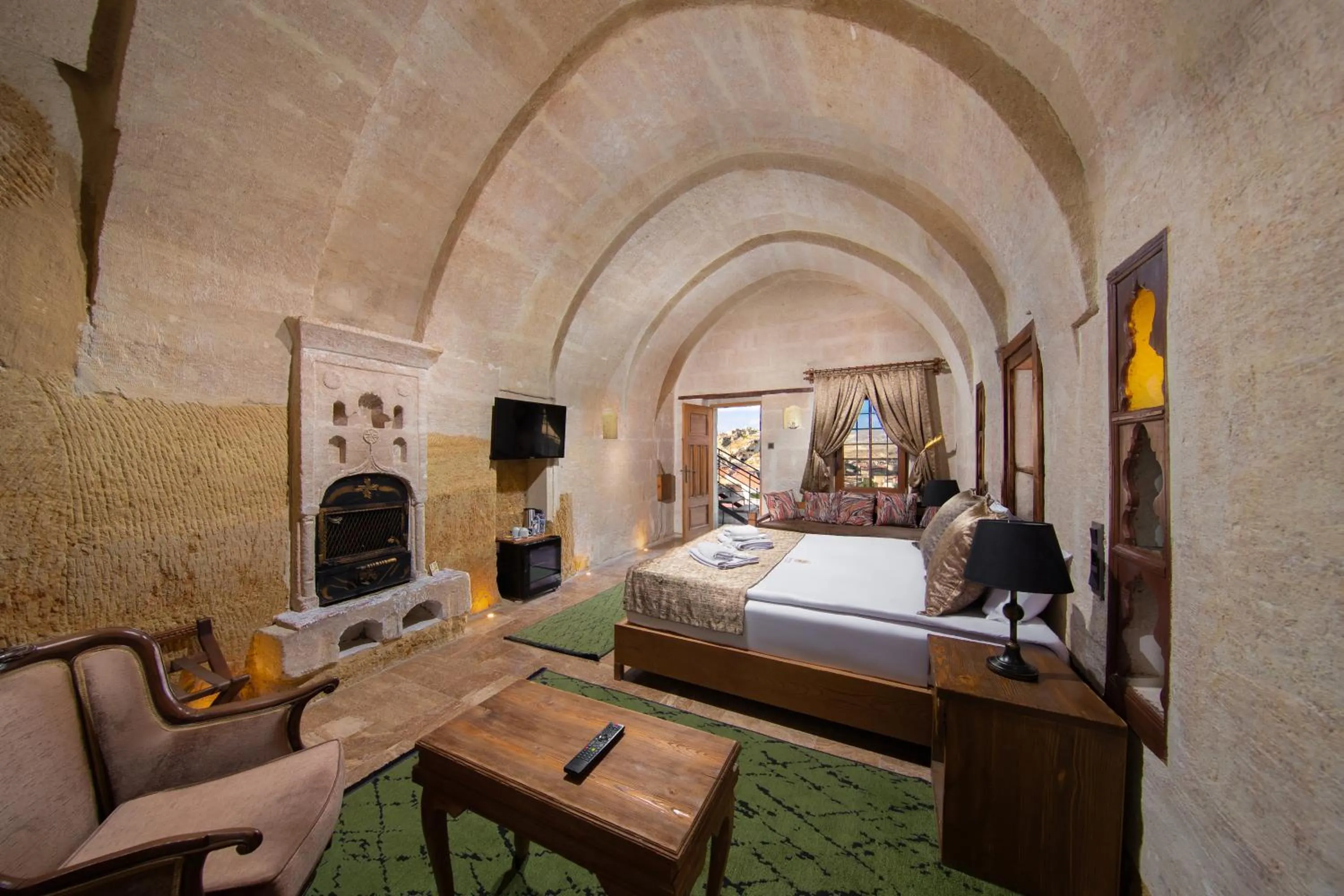 Photo of the whole room, Bed in Dionysos Cave Cappadocia Hotel