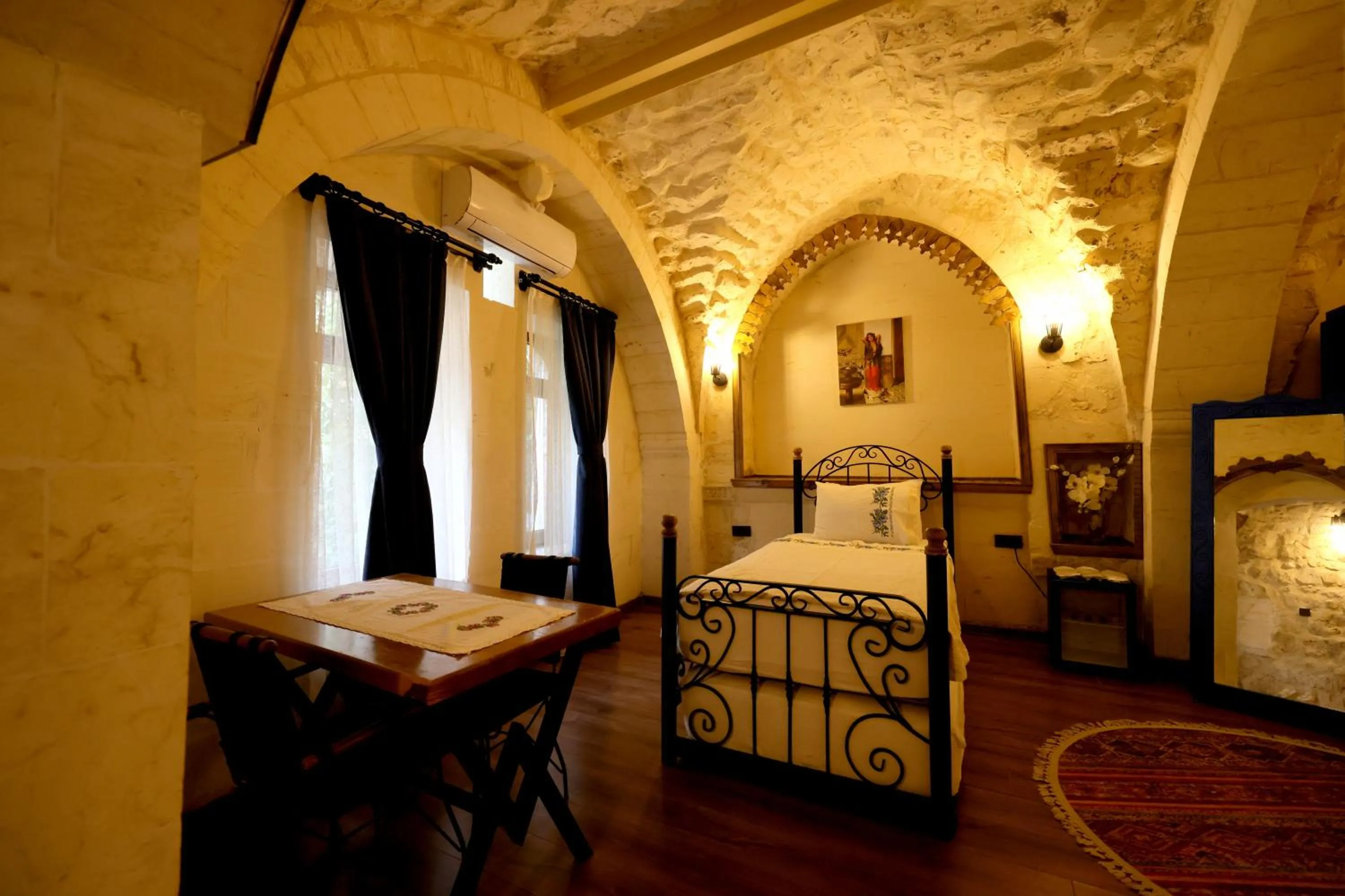 Bed in ASTARTE HOTEL