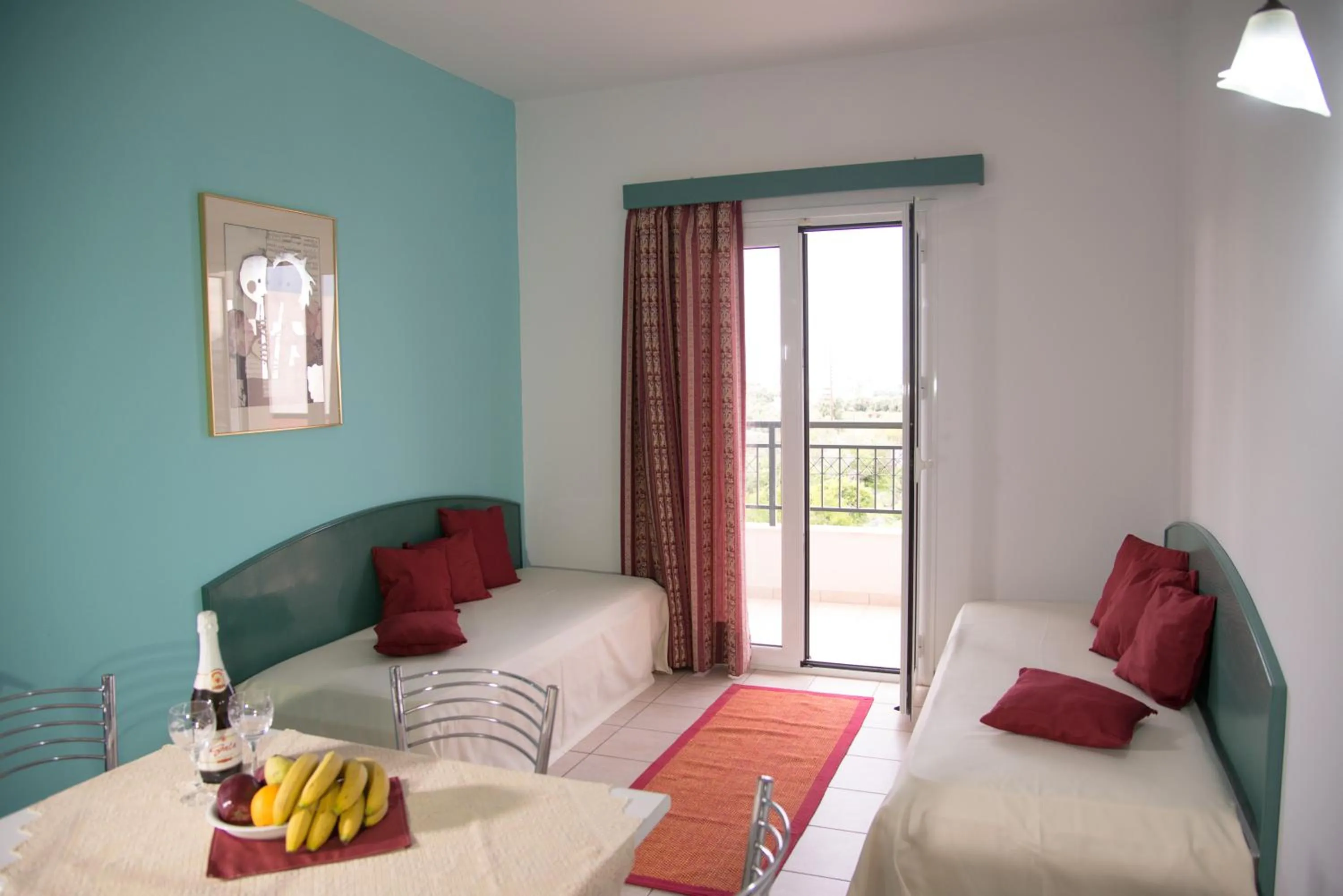 Living room, Bed in Theoni Apartments