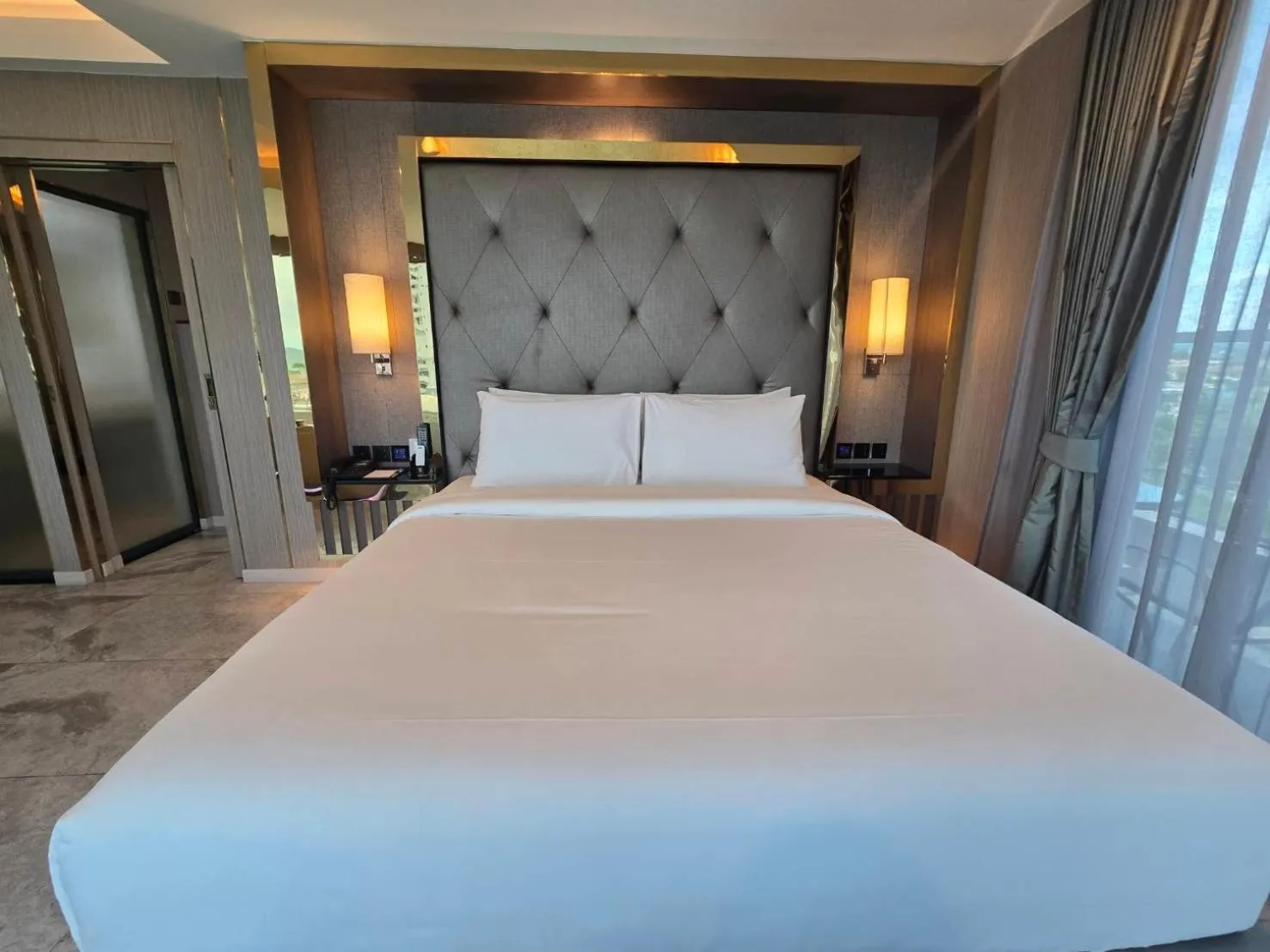 Bed in THE TJ HOTEL Pattaya