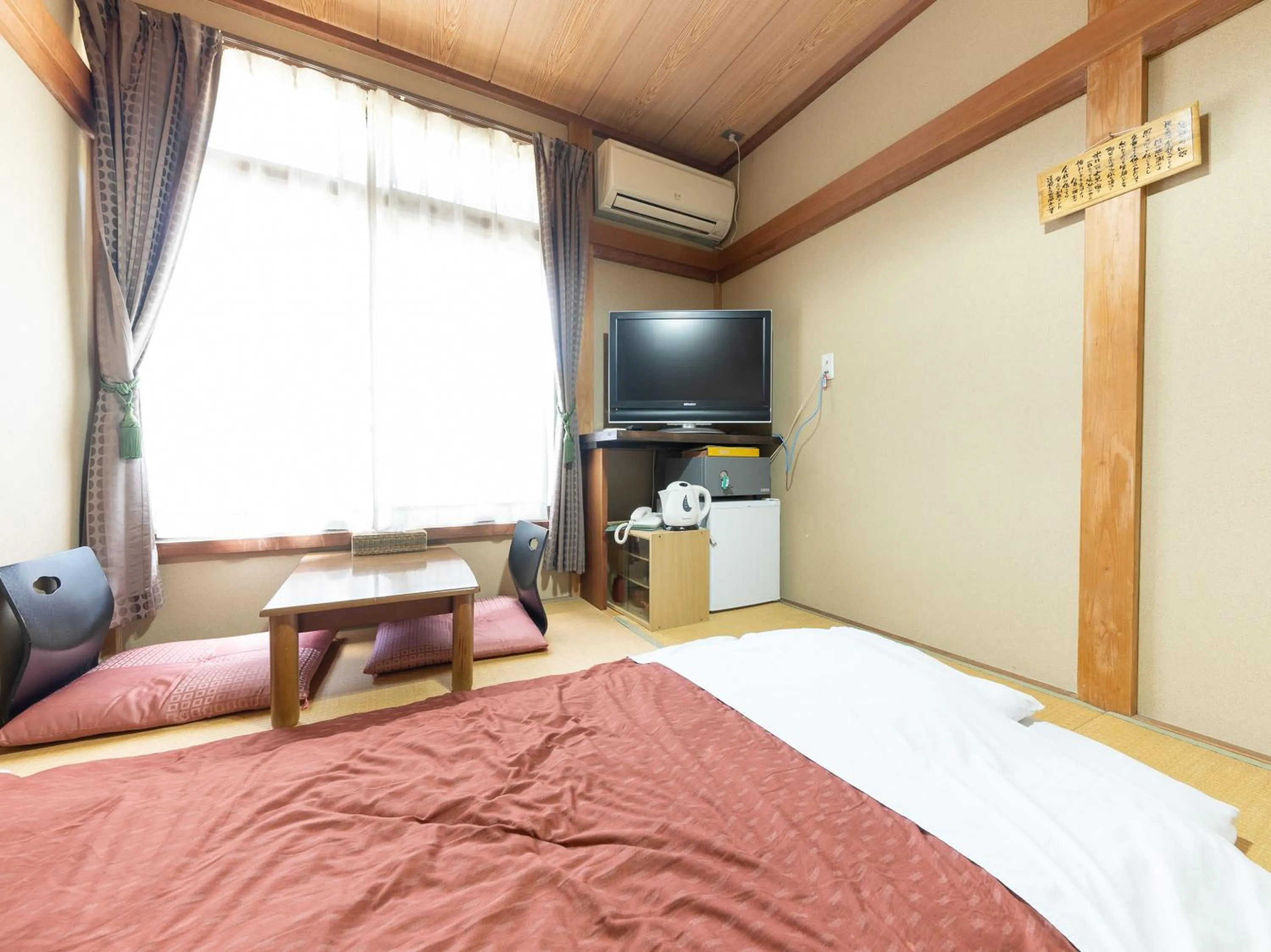 Bed in Tabist Hotel Iyashi no Sato