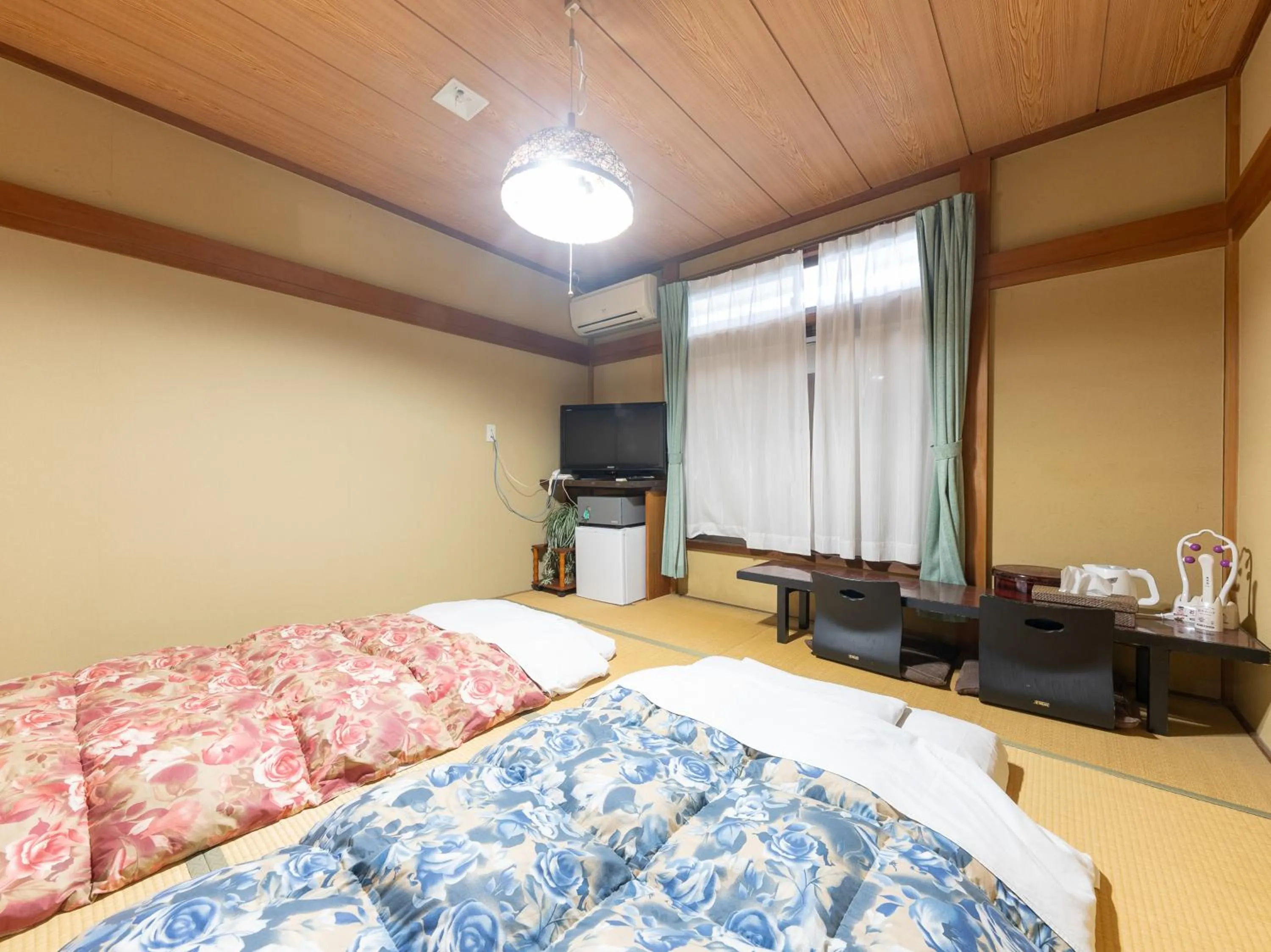 Bed in Tabist Hotel Iyashi no Sato