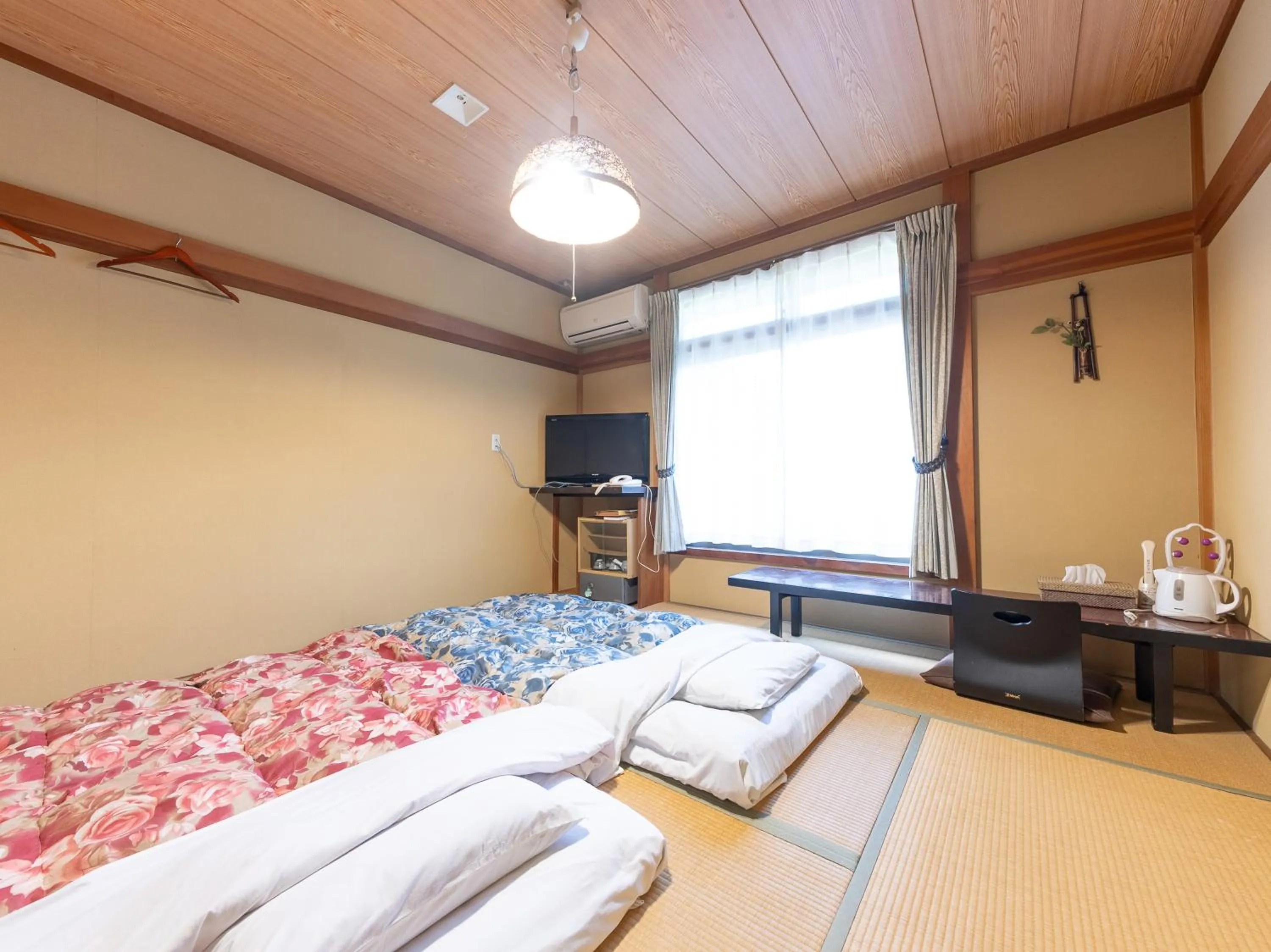 Bed in Tabist Hotel Iyashi no Sato
