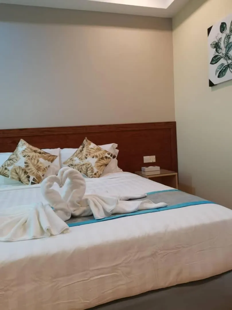 Bed in TD CAPITAL HOTEL