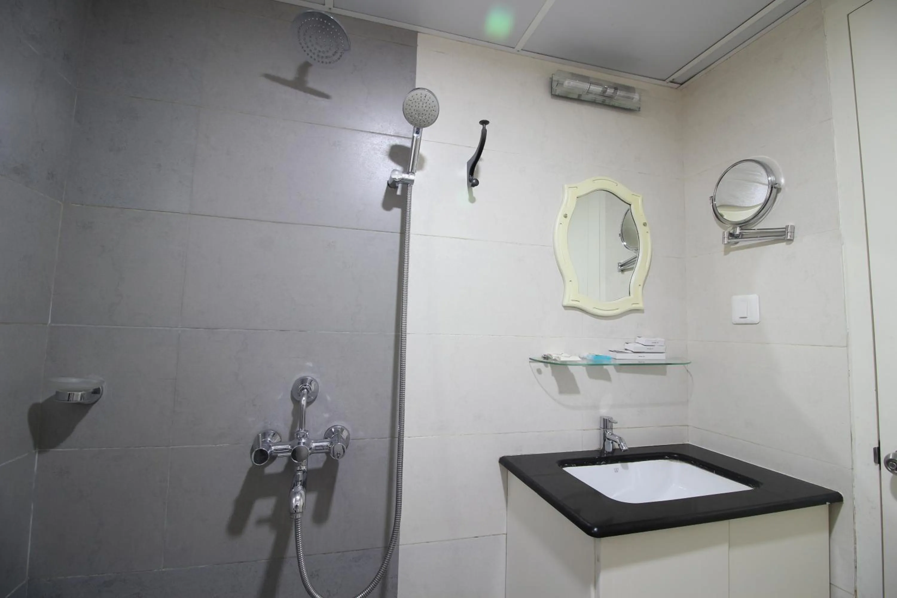 Bathroom in Srivar Hotels