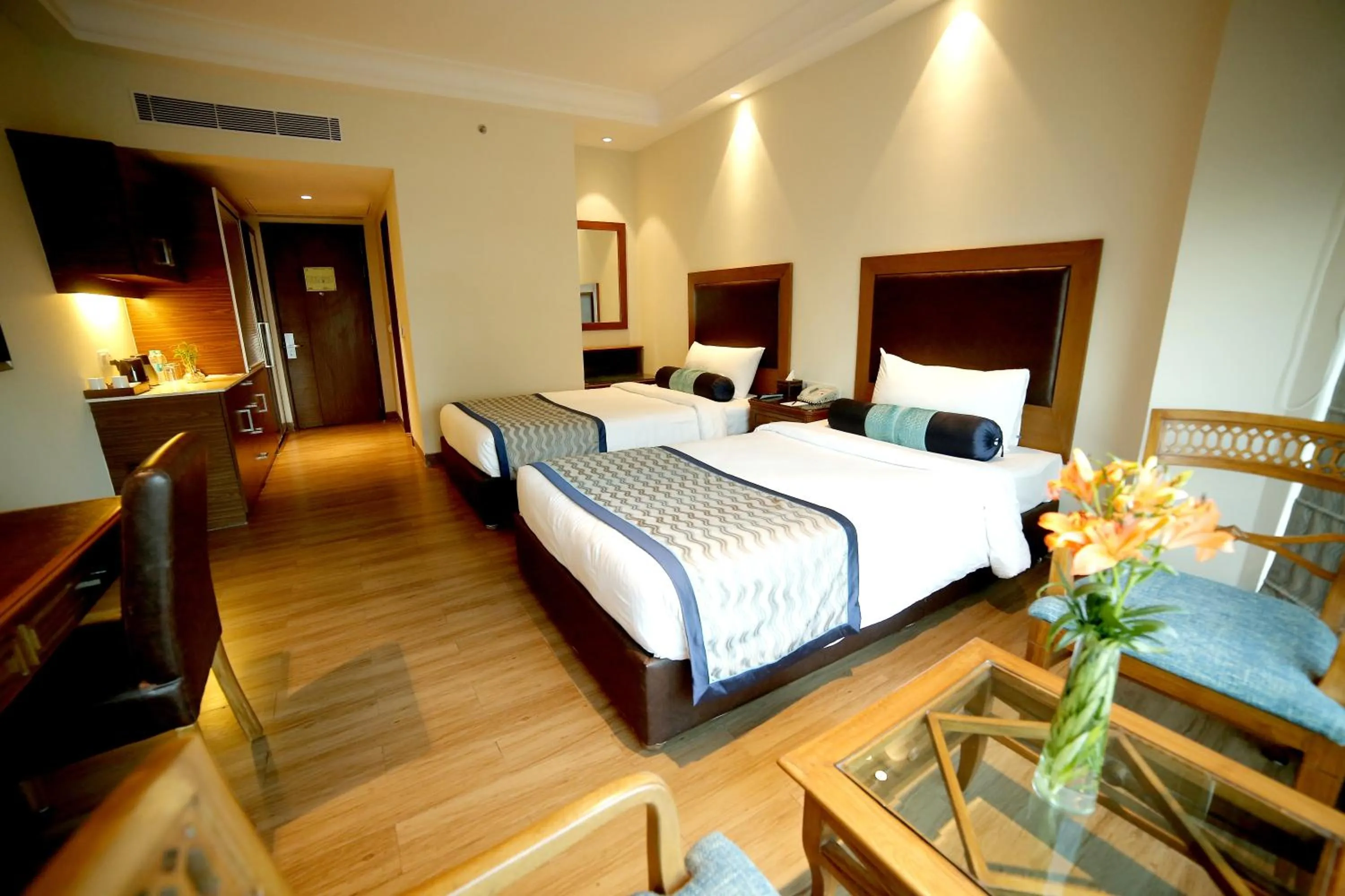 Photo of the whole room, Bed in The Lalit Traveller- Airport hotel
